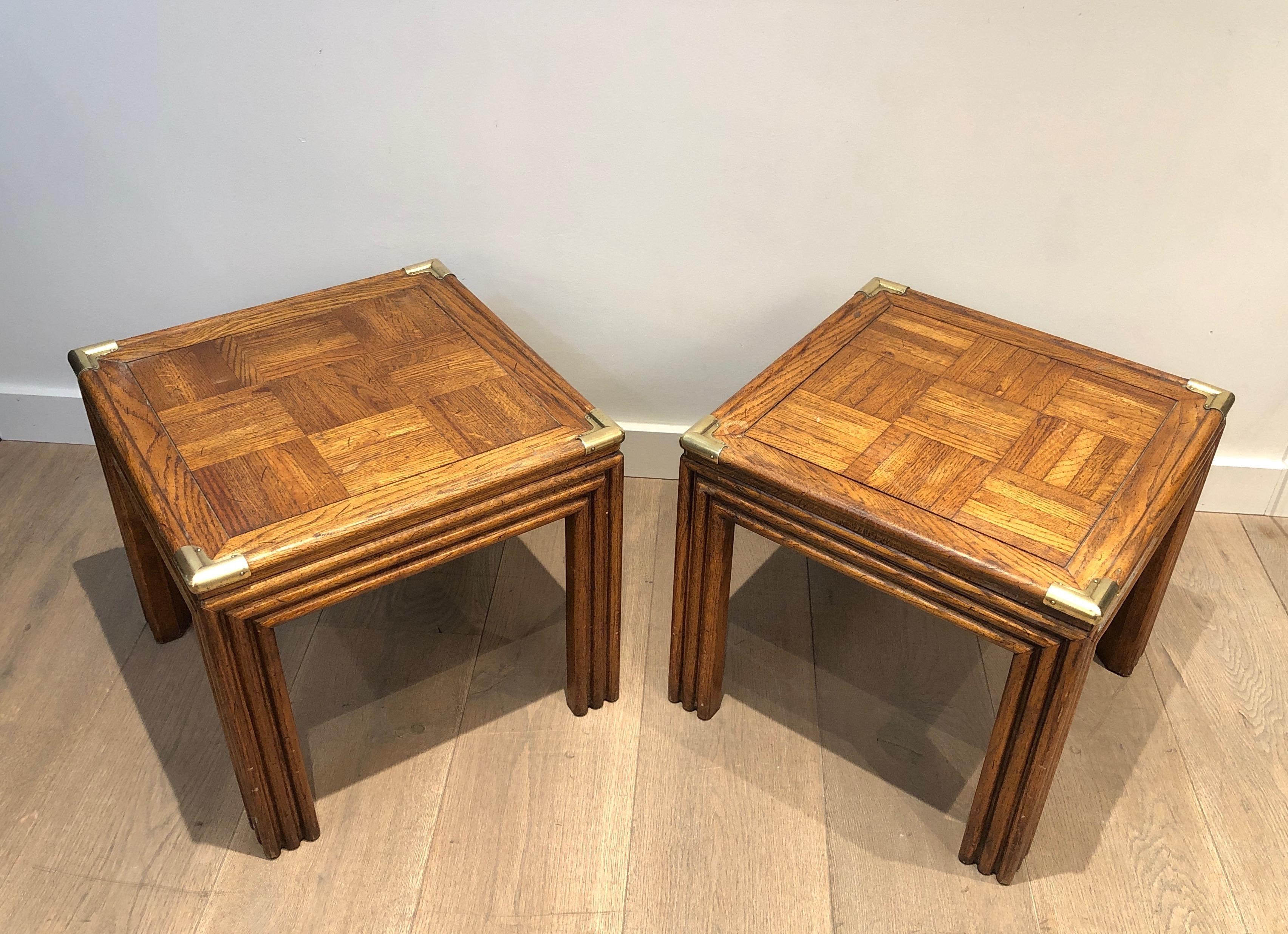 This pair side tables is made of wood and brass with wood marquetry on tops. French work. Circa 1970.