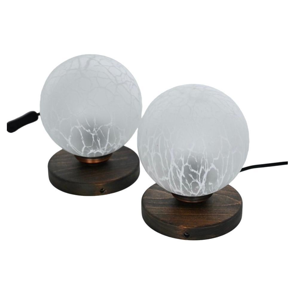 Pair of wood and crackle effect glass globe table lamps. Yugoslavia circa 1970. For Sale