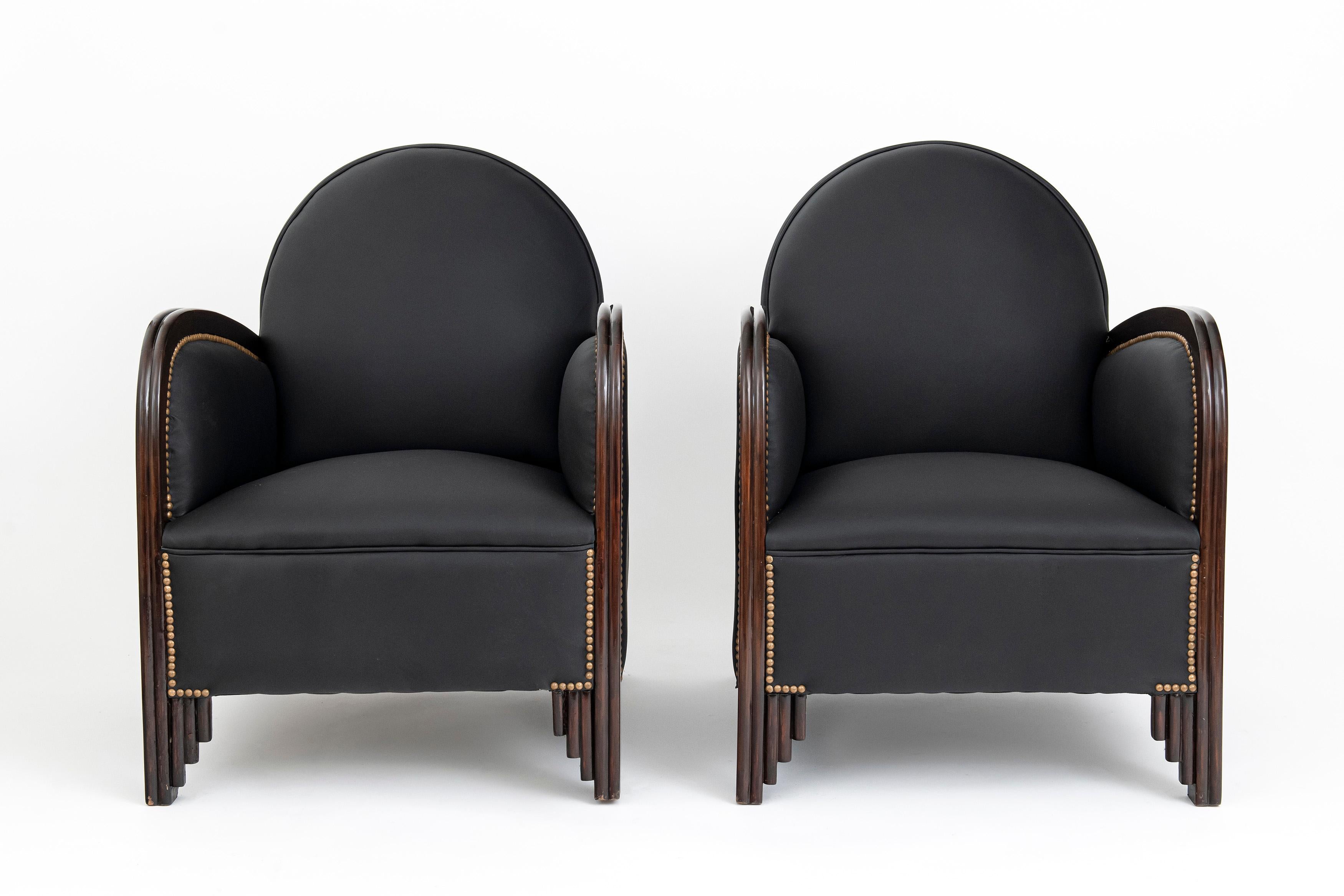 Pair of wood and leather armchairs. Art Deco period, France, circa 1930.
 