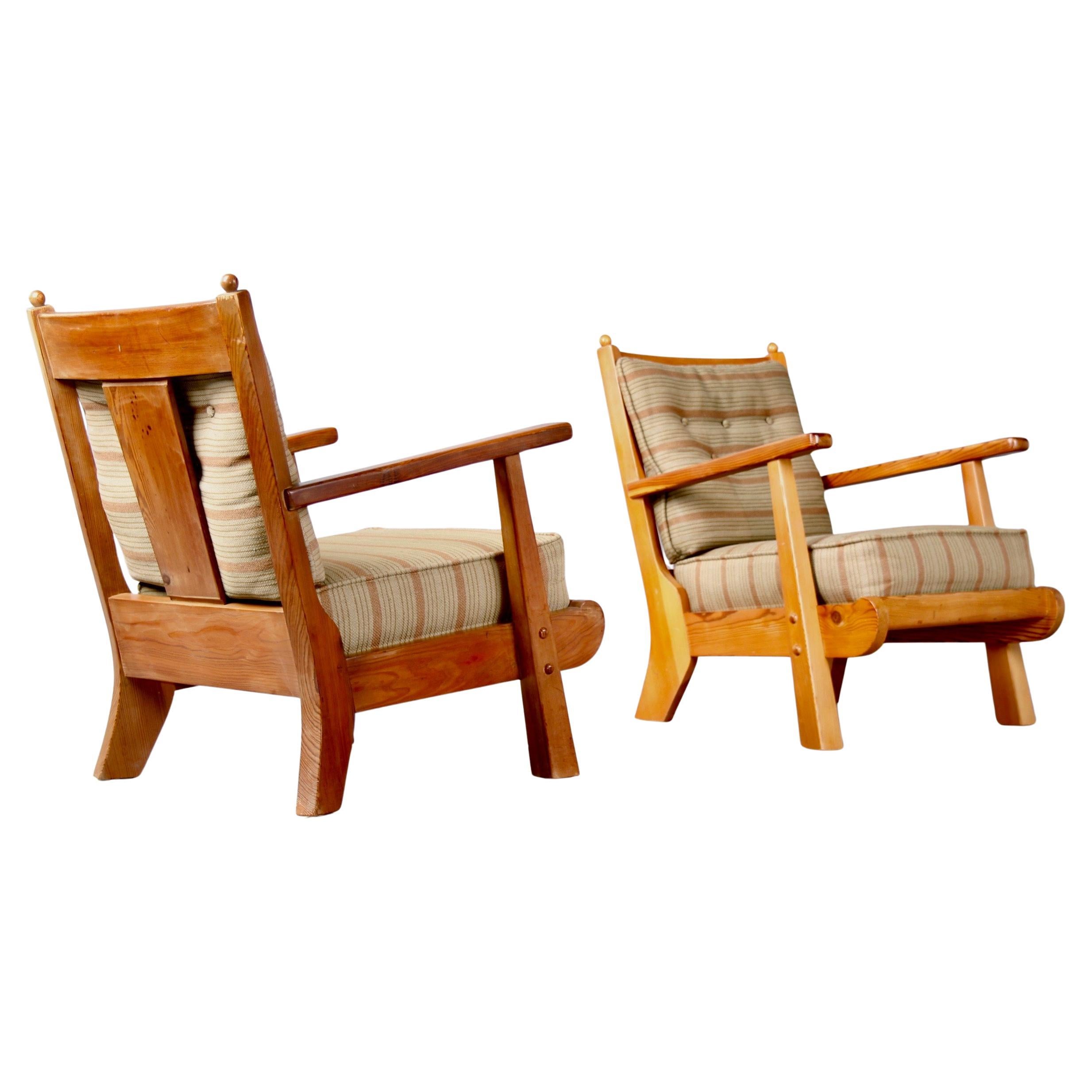 Pair of wood and leather mid century armchairs