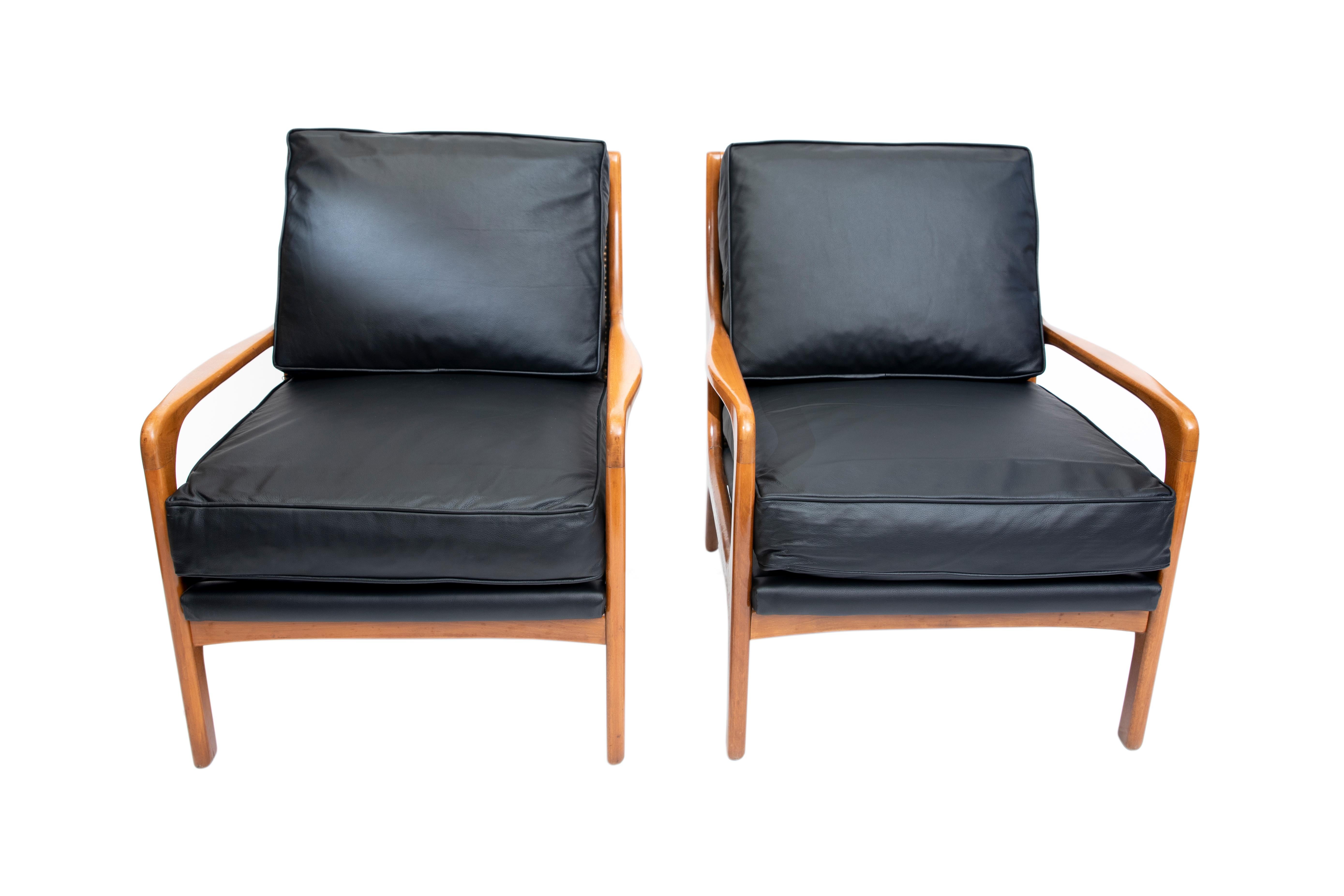 Pair of wood and leather Scandinavian armchairs, circa 1960.