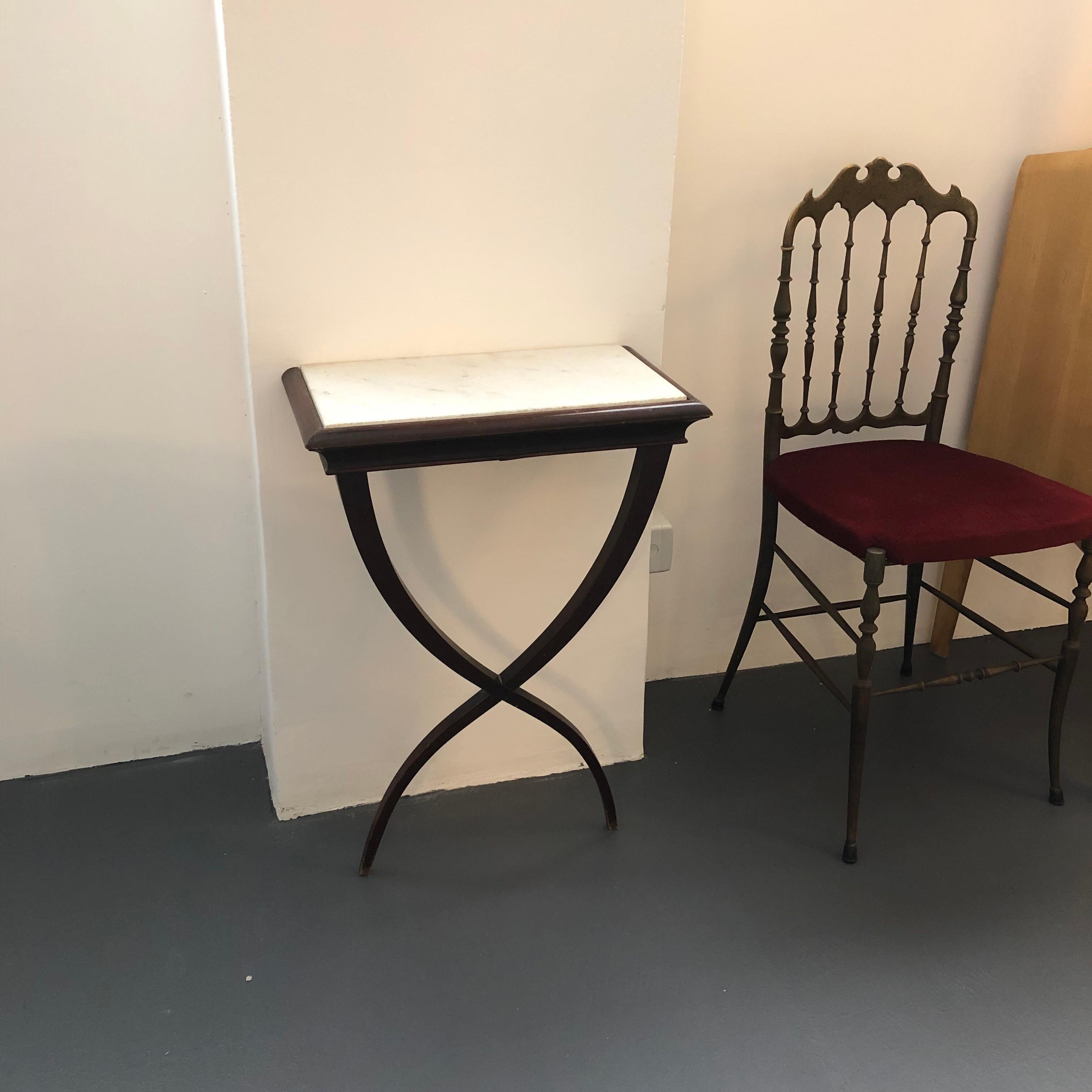Elegant set of two dark wood and white marble consoles designed by Buffa and produced in Italy during the 1950s.
