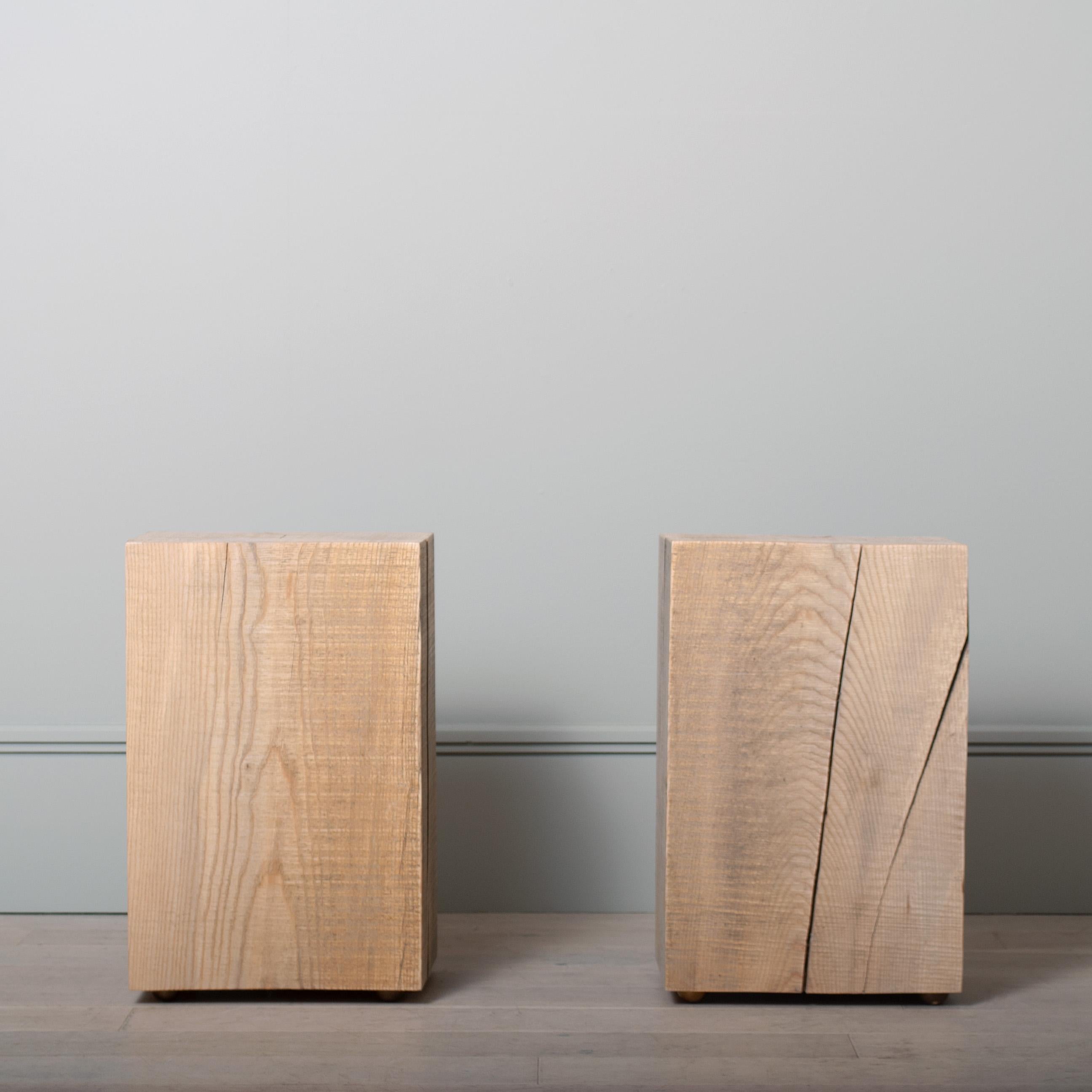 A pair of wood block solid English Ash side tables with brass feet. Cut, sanded and finished in durable Osmo oil. Excellent multi purpose side tables/plinths and are at standard seating height for use as occasional stools. Beautiful English Ash