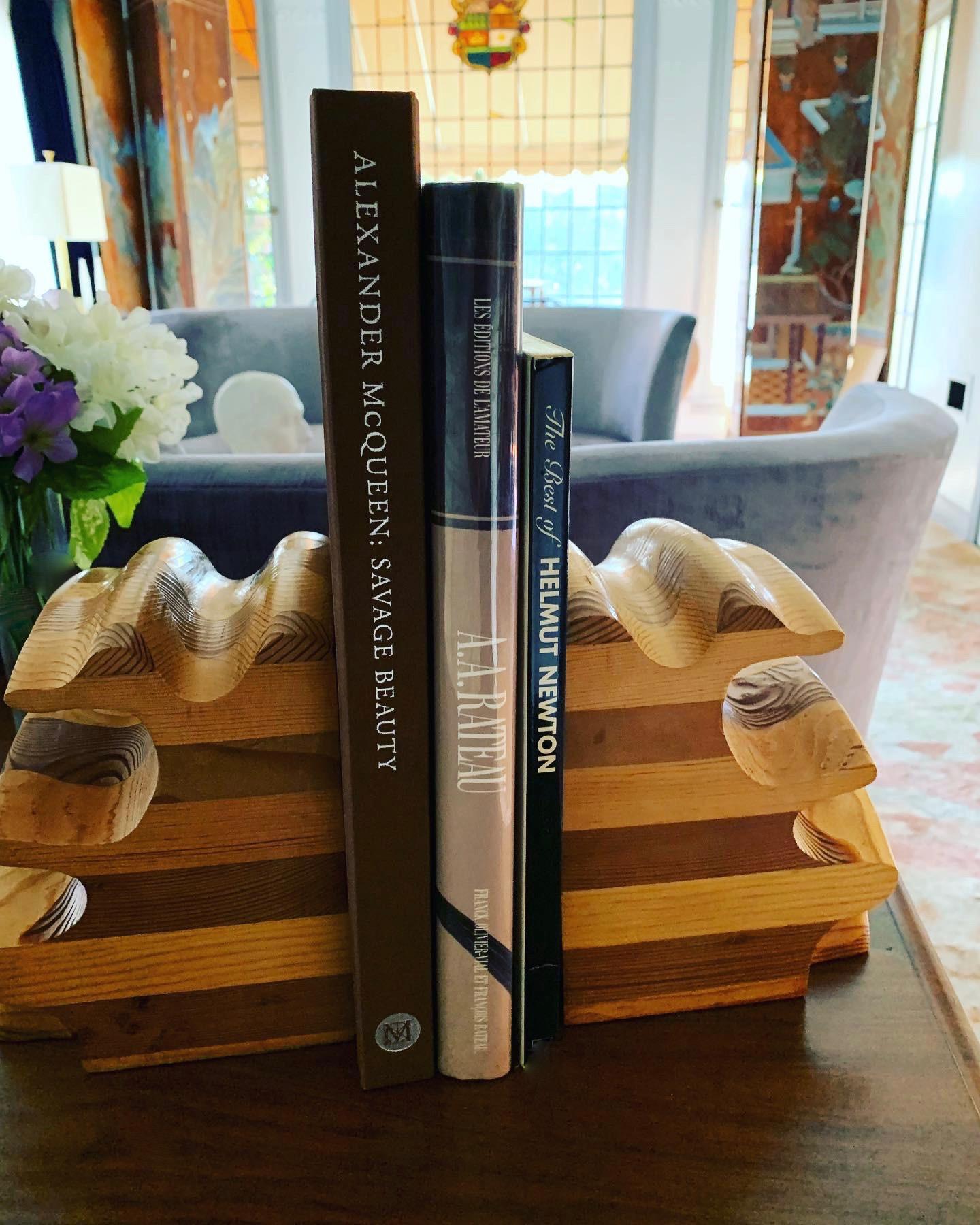 A remarkable pair of handmade wooden bookends using layers and cuts to create a spectacular shape... perfect for any setting with books... modern, organic or traditional. These may be by Don Shoemaker.