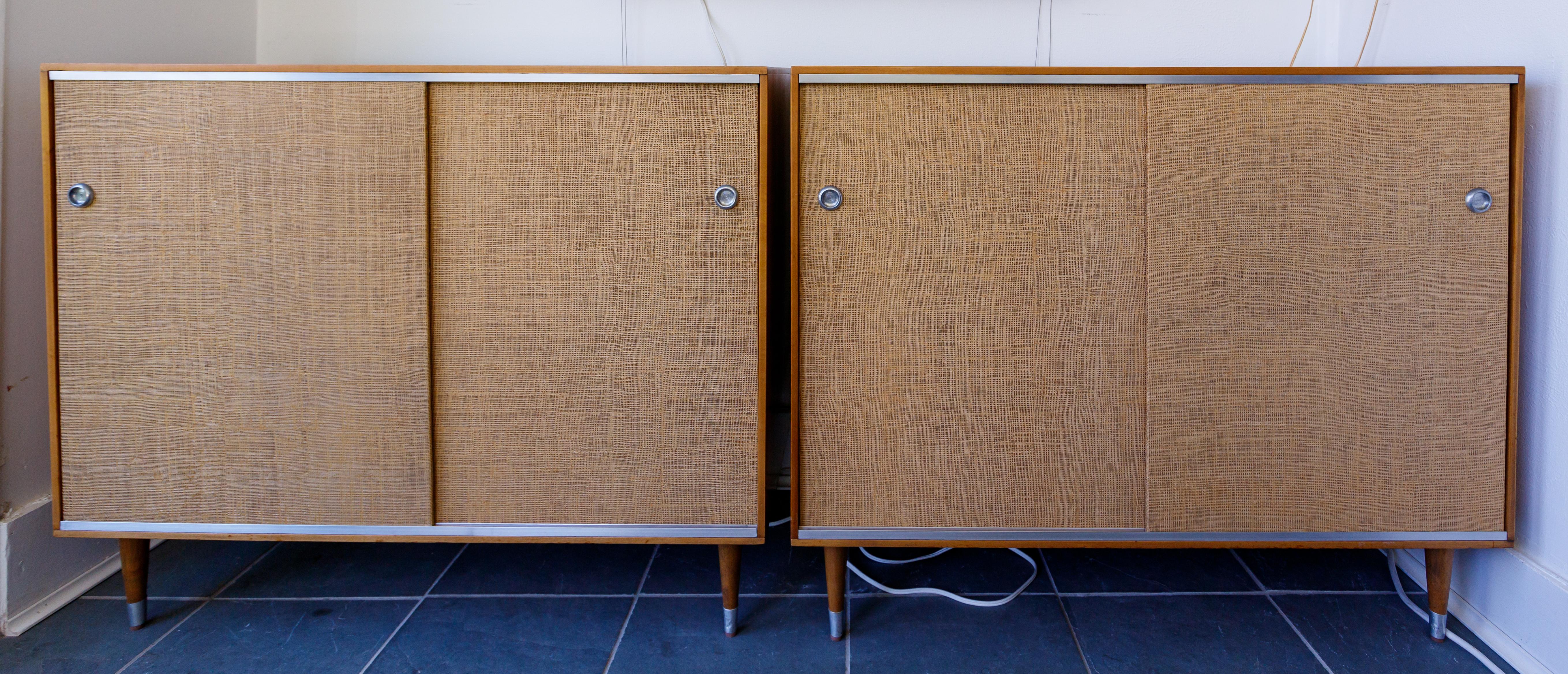 Mid-Century Modern Pair of Wood Cabinets with Sliding Grass Covered Doors, by Herman Miller For Sale