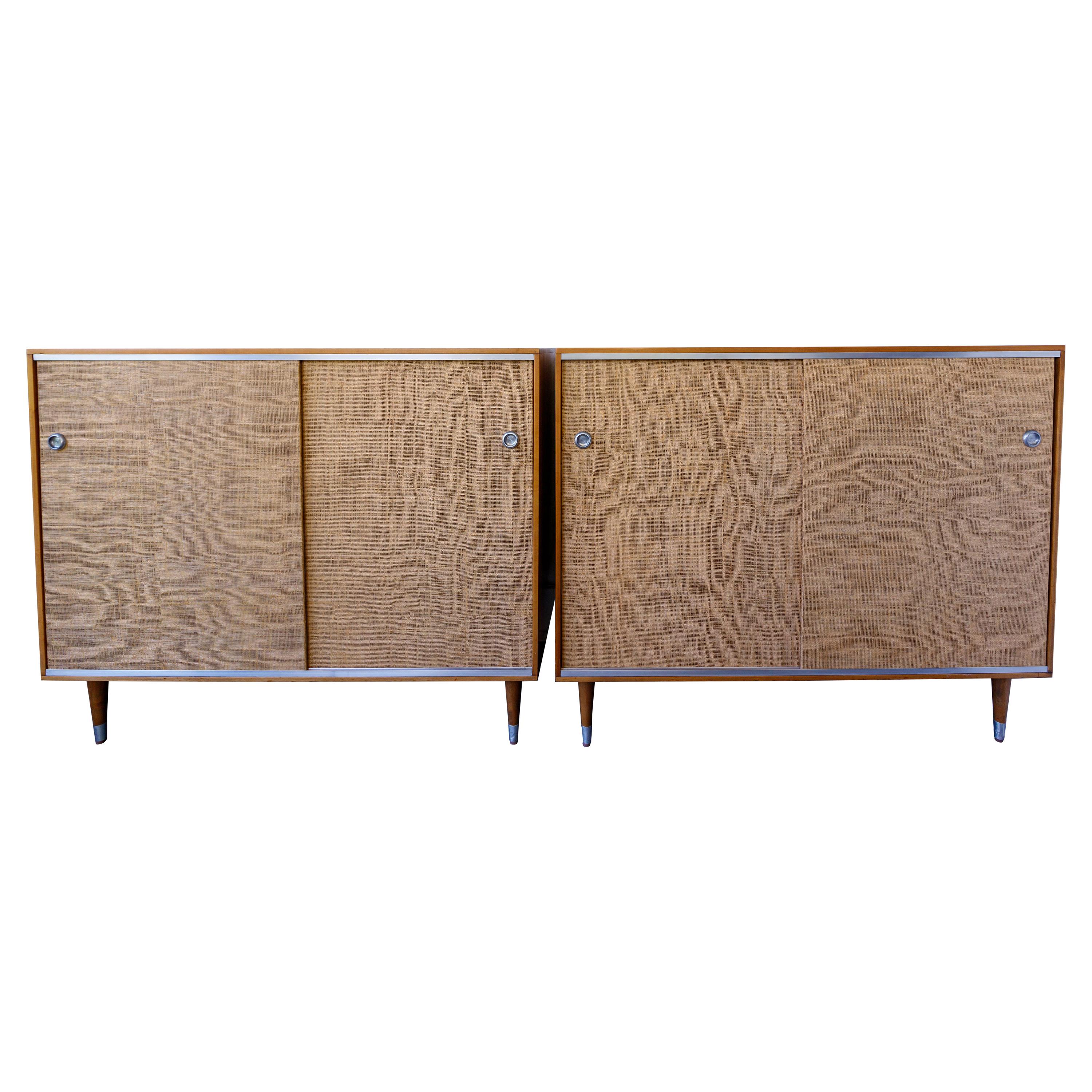 Pair of Wood Cabinets with Sliding Grass Covered Doors, by Herman Miller For Sale