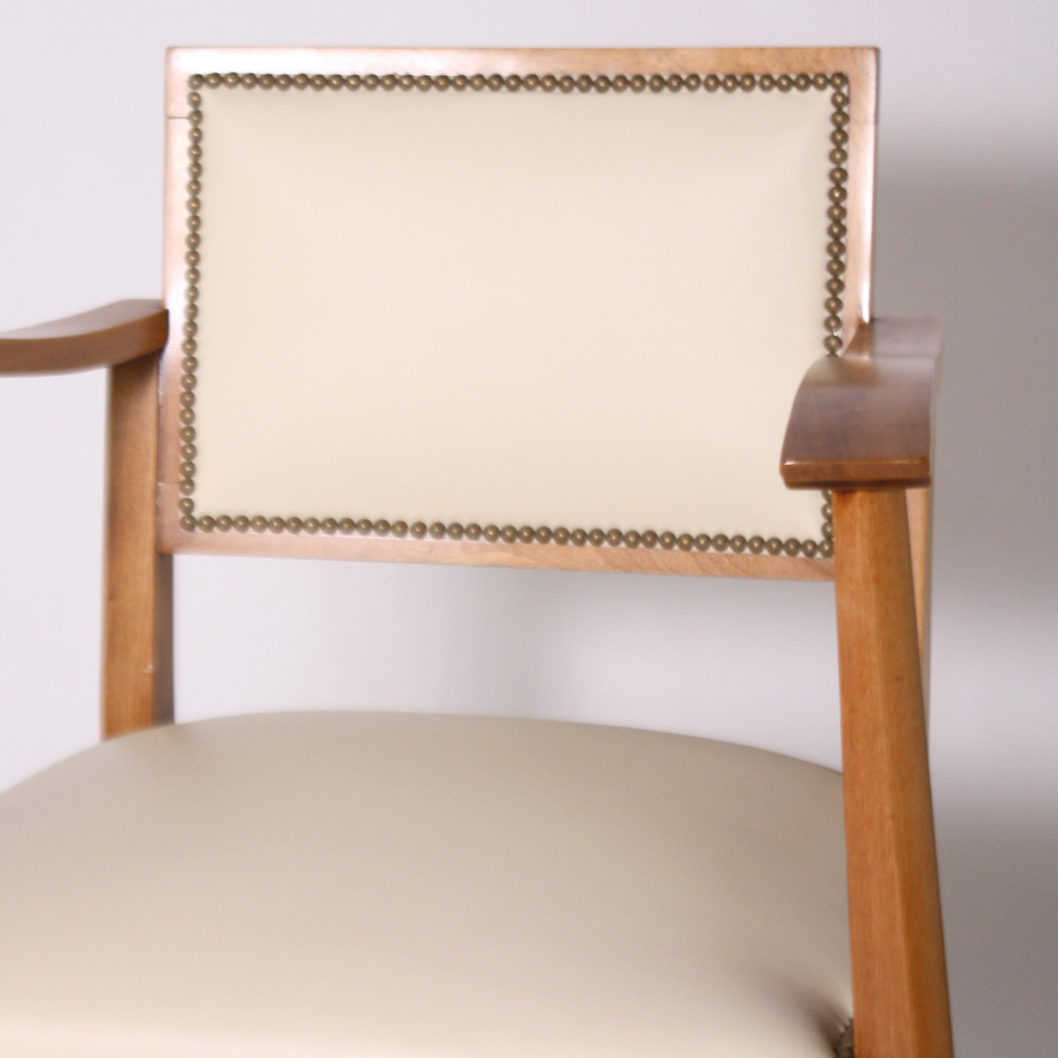 Pair of wood frame armchairs with leather, circa 1960.