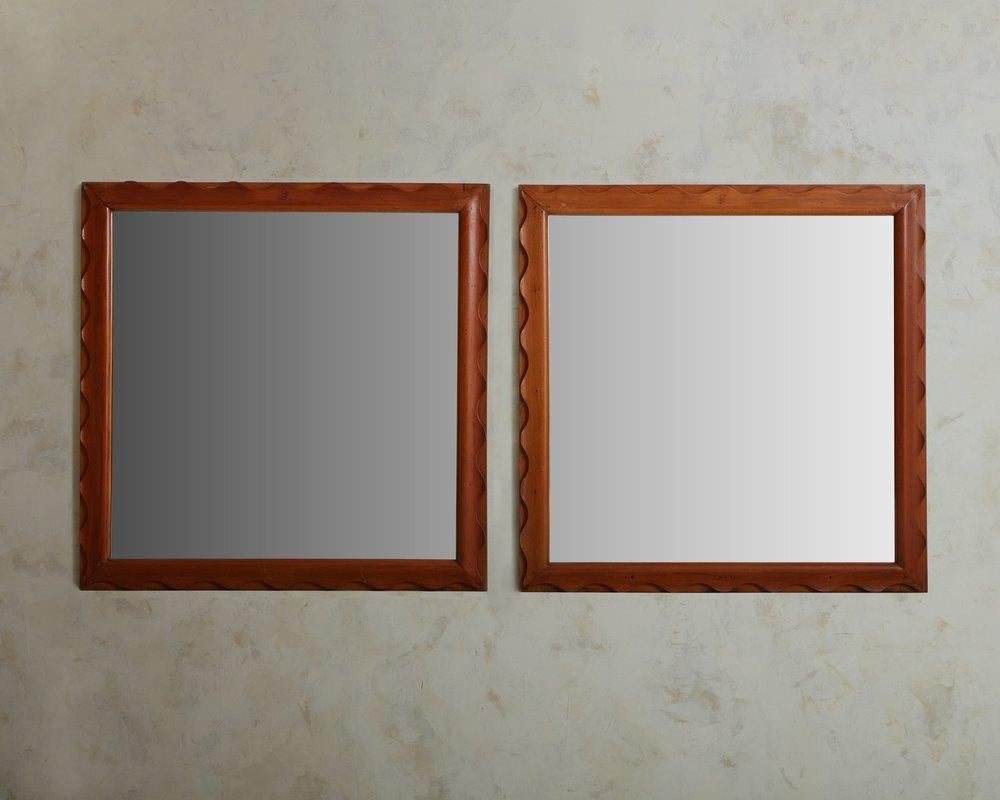 1970s Italian wall mirror with square wood frame. The frame feature an overlaid wood detail with curved edges. Unmarked. Sourced in Italy, 1970s. Sold Separately