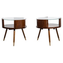 Pair of wood, glass and bronze round coffee tables. Argentina, circa 1960.
