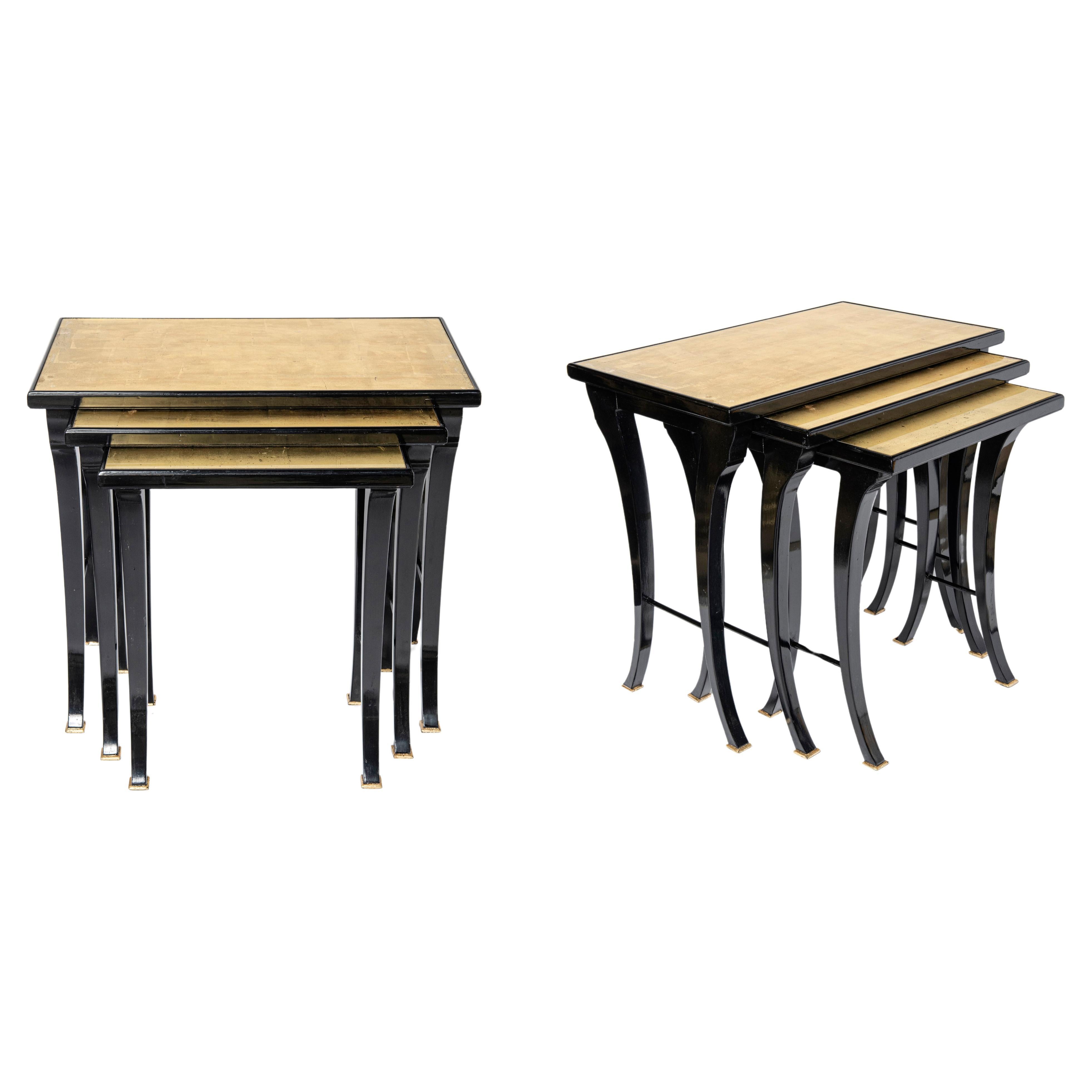 Pair of wood, glass and gold leaf nest tables by Maison Jansen. France, c. 1950. For Sale
