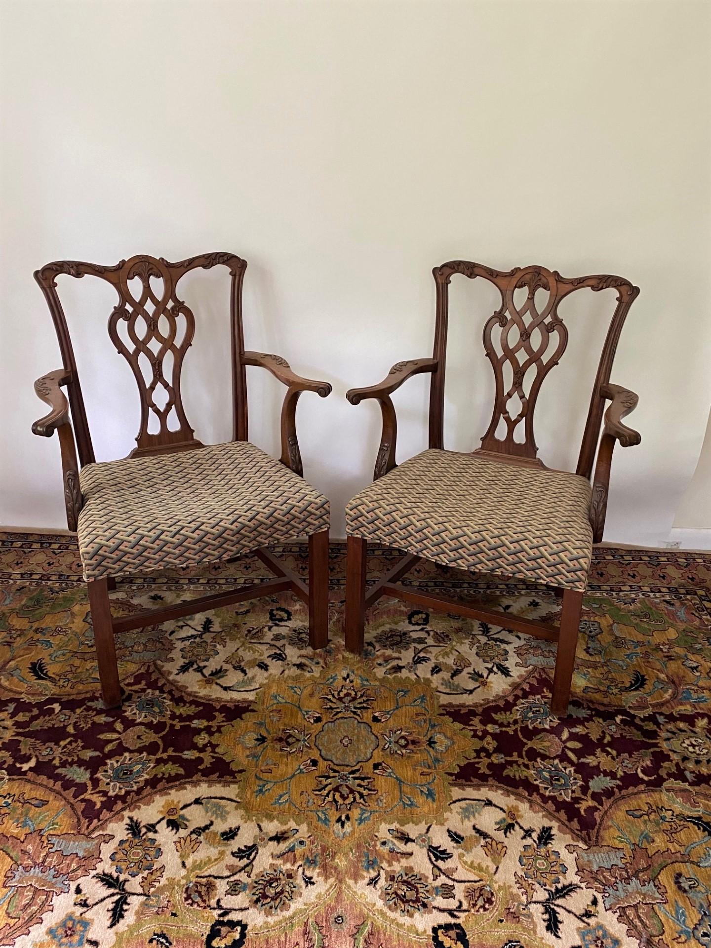 A very fine solid mahogany Chippendale style armchair is a true testament to Classic design and craftsmanship. This pair of armchairs exudes elegance and sophistication with its exquisite details and rich materials.
These chairs features a
