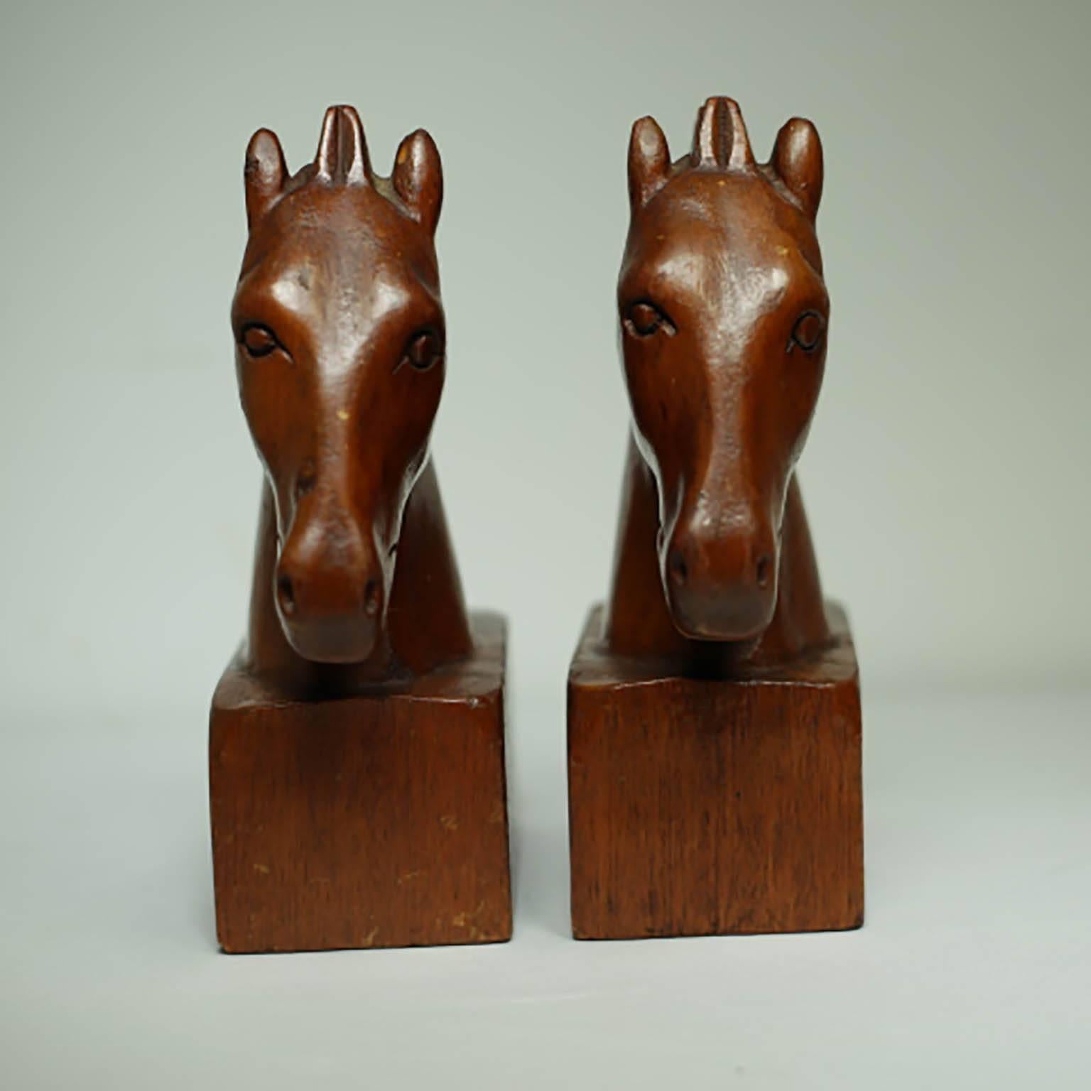 ABOUT
This is an original pair Trojan horse bookends. The bookends are carved wood with a reddish brown varnish. The use of wood and the overall look of the bookends is very in keeping with the style of the early 1950s. Both pieces have retained