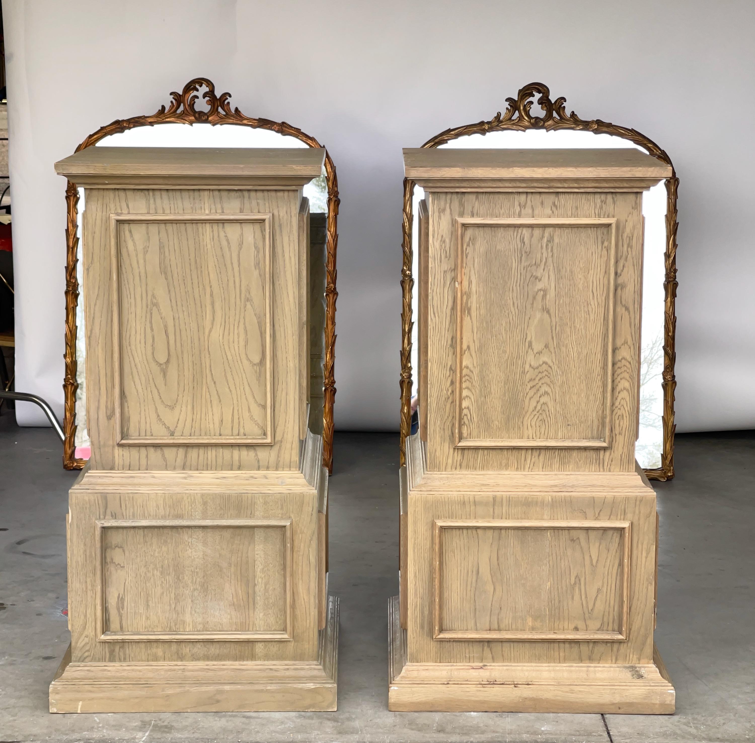 Pair of stained wood display pedestals retailed by Restoration Hardware circa 1993. Decorated on four sides with square moldings.
42 inches high by 22 inches wide by 22 inches deep. 19.75 inches square in center.
