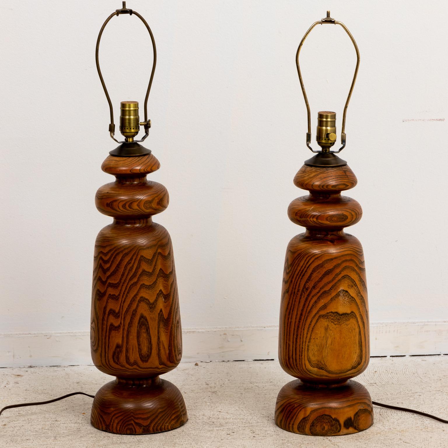 Pair of wood bulb turned table lamps. Shades not included. Please note of wear consistent with age.