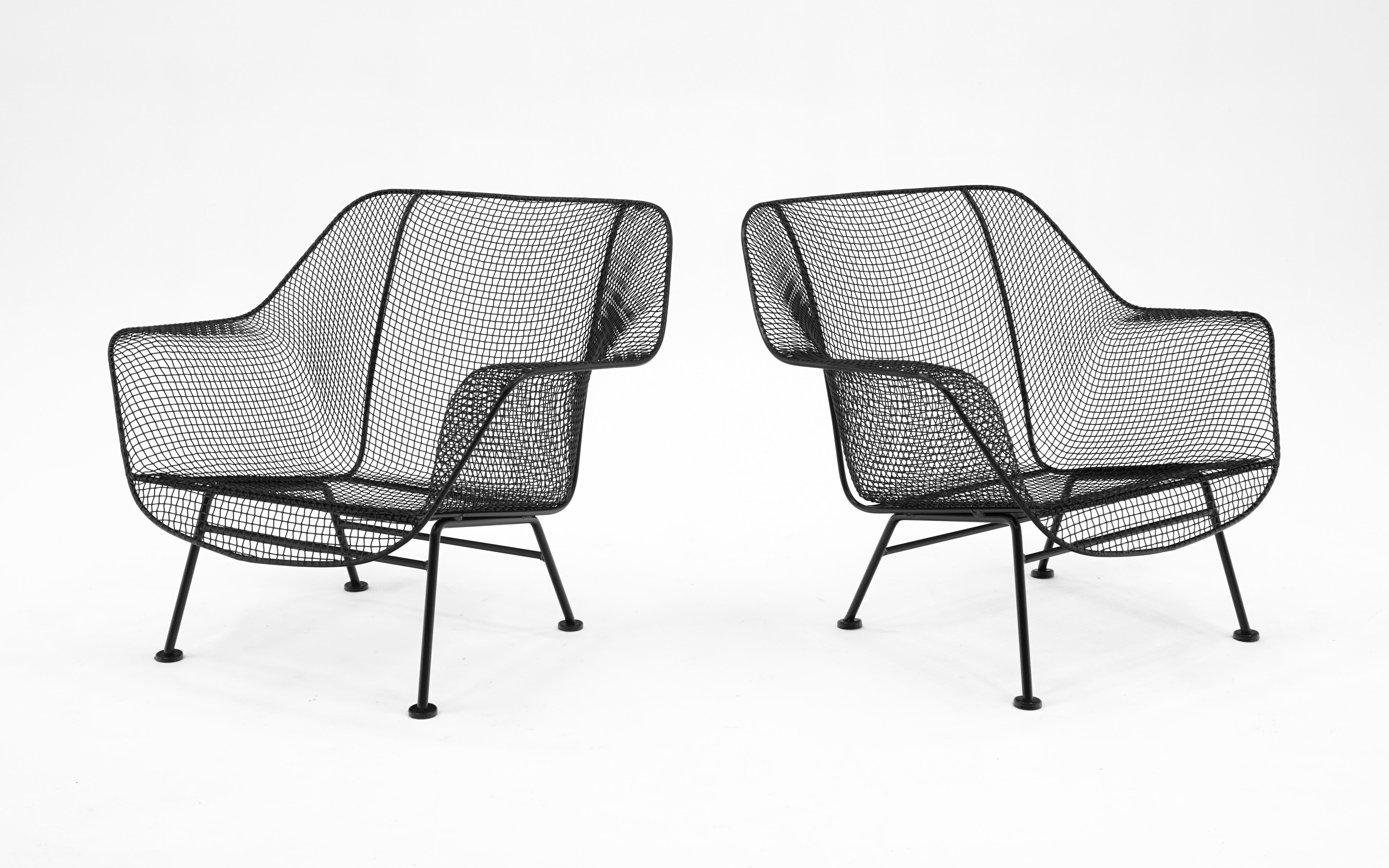 Often attributed to Russell Woodard but designed by John Woodard, these two outdoor, pool, patio lounge chairs have been professional media blasted and powder coated in a satin black finish. Ready to use.