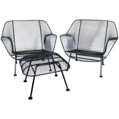 Pair of Woodard Wrought Iron and steel Mesh Lounge Chairs with matching ottoman