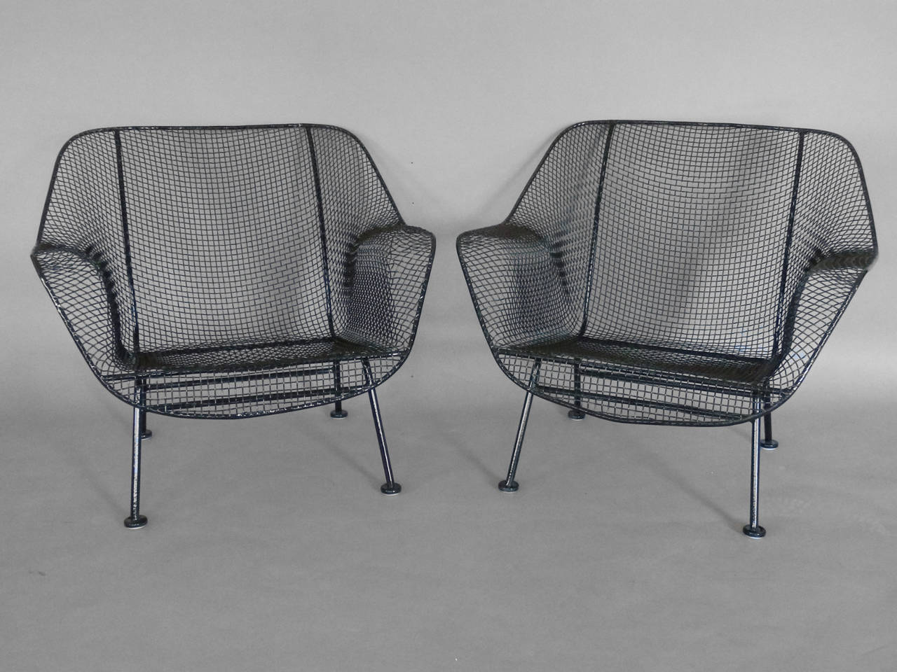 Mid-Century Modern Pair of Woodard Wrought Iron and steel Mesh Lounge Chairs with matching ottoman