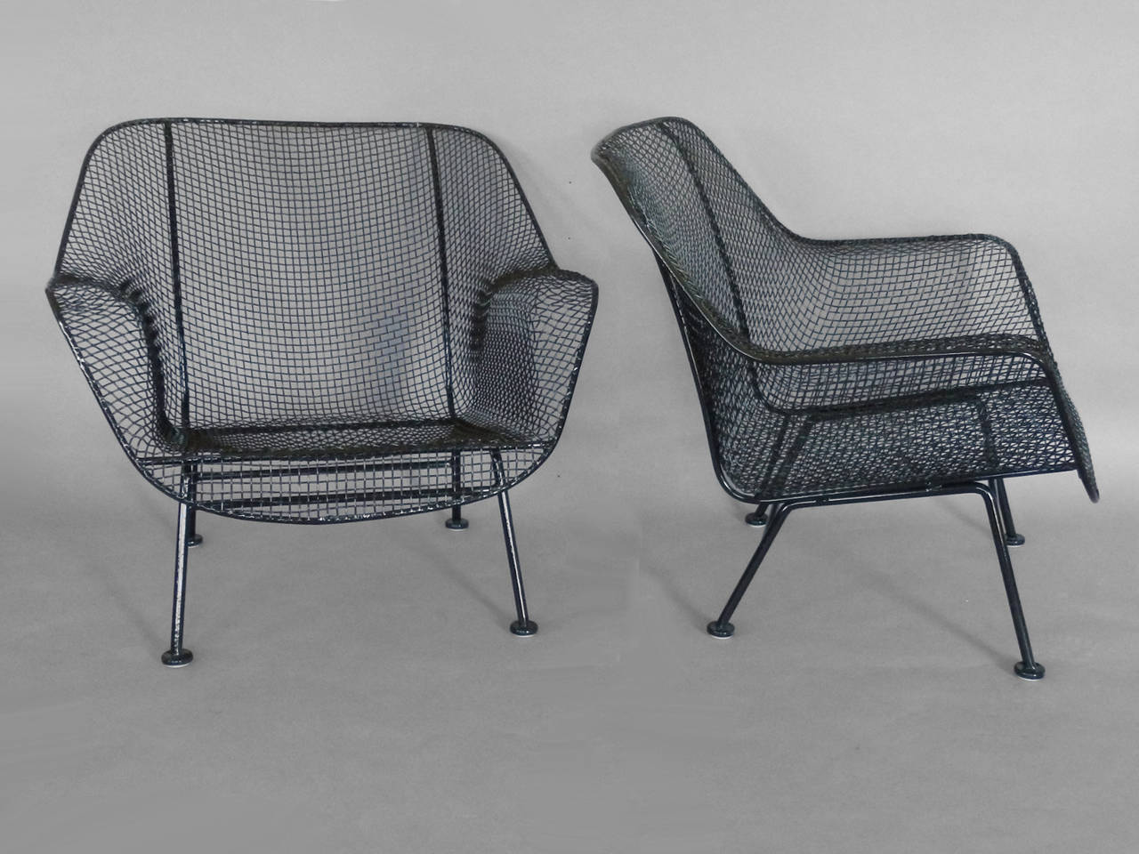 American Pair of Woodard Wrought Iron and steel Mesh Lounge Chairs with matching ottoman