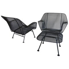 Pair of Woodard Wrought Iron and steel Mesh Lounge Chairs with matching ottoman