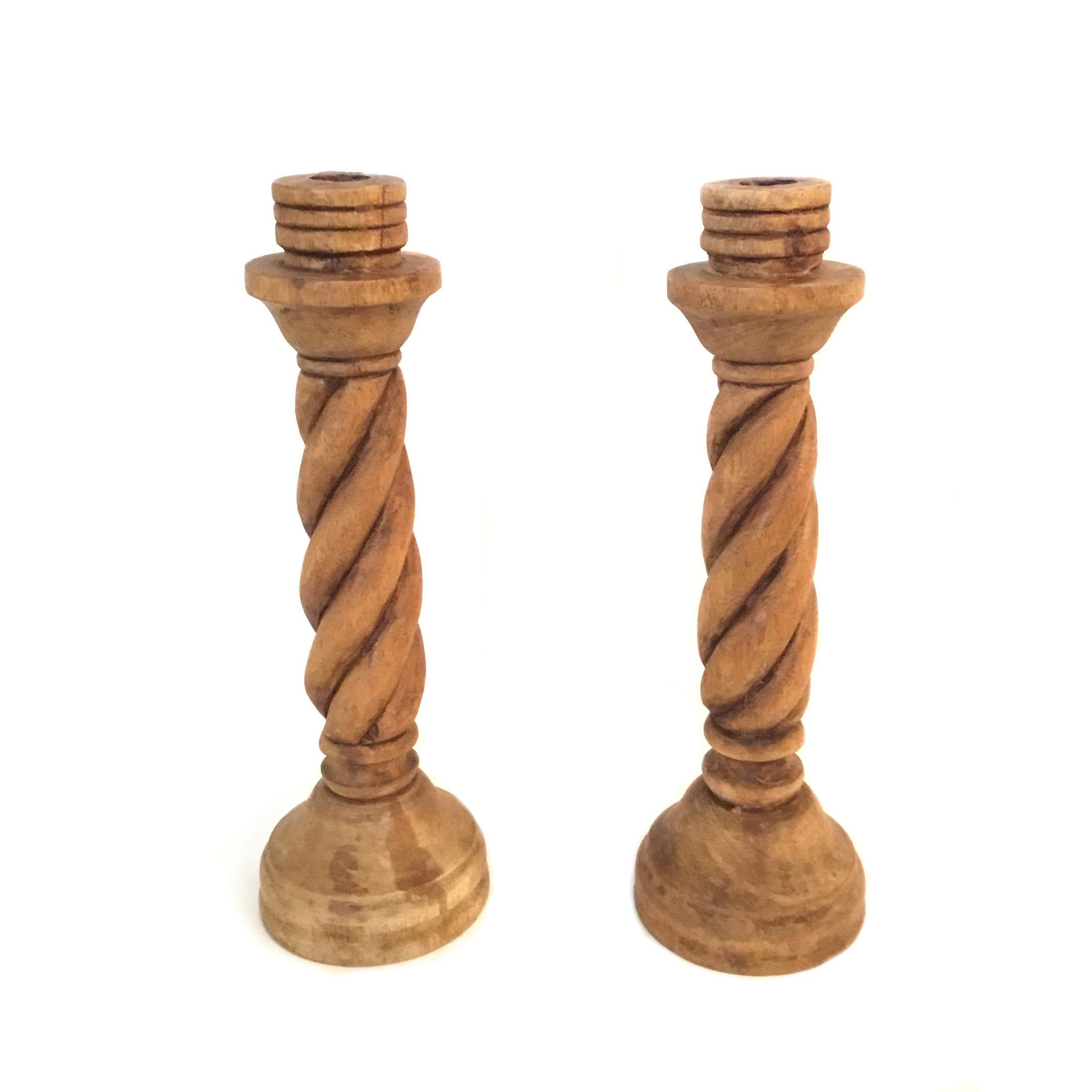 This pair of wooden barley twist candlesticks will create a simple statement atop any surface. These candleholders were made in the 21st century in the style of English Queen Anne.
  