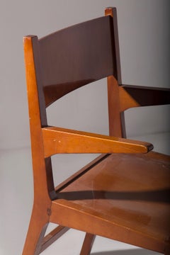 Pair of wooden chairs with armrests