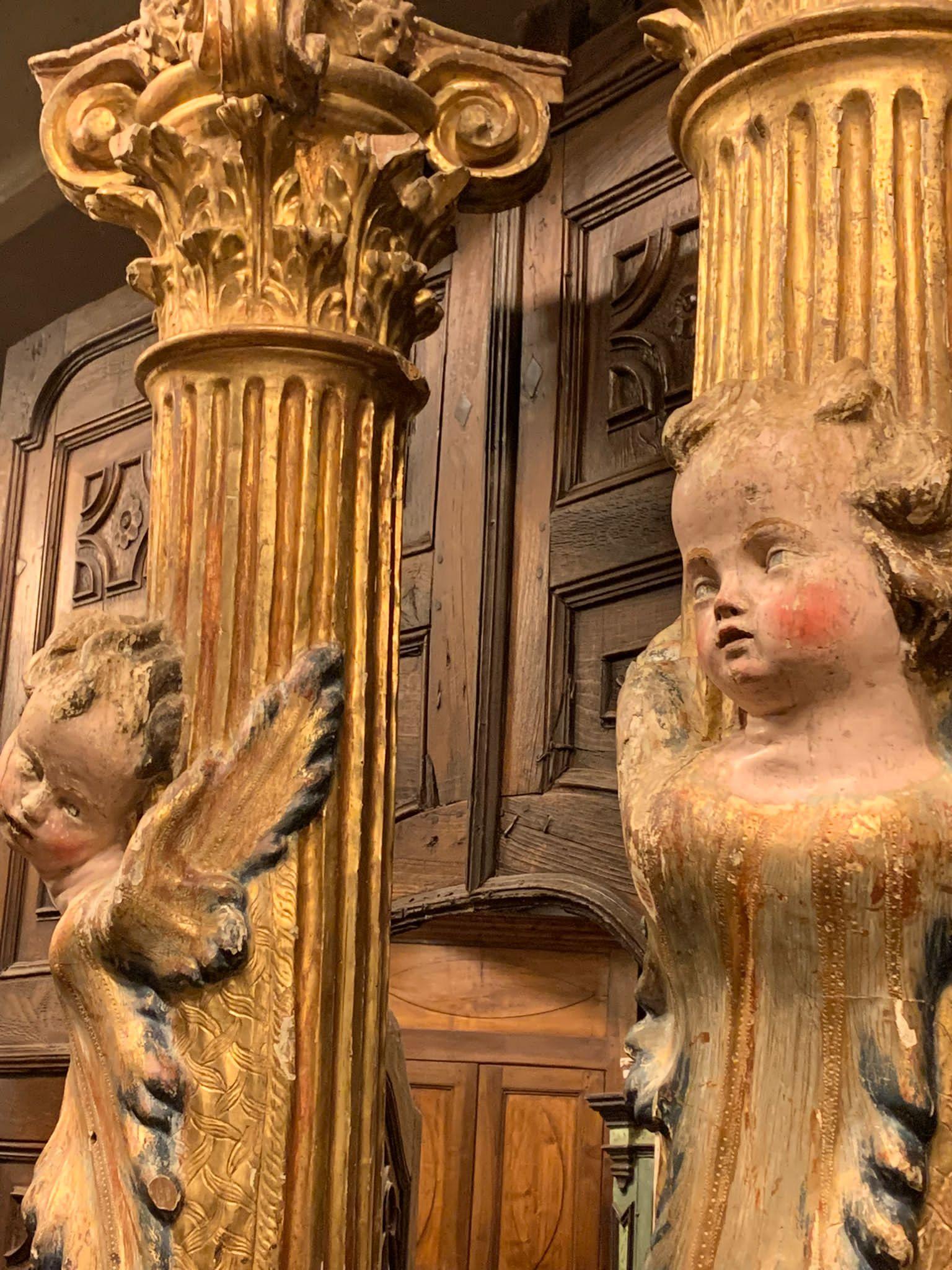 Italian Pair of wooden columns, carved and gilded with polychrome putti, from Spain For Sale