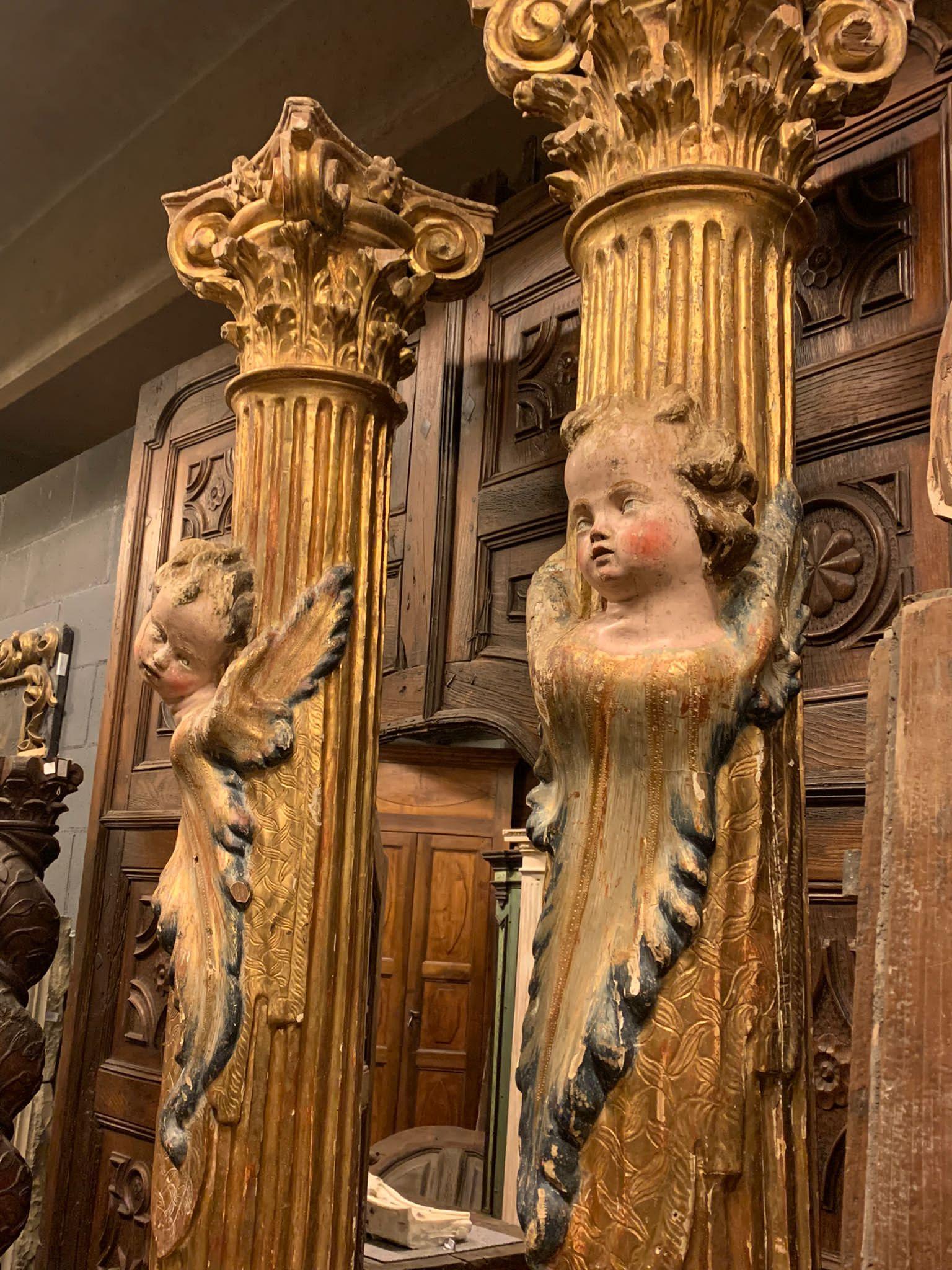 Hand-Carved Pair of wooden columns, carved and gilded with polychrome putti, from Spain For Sale