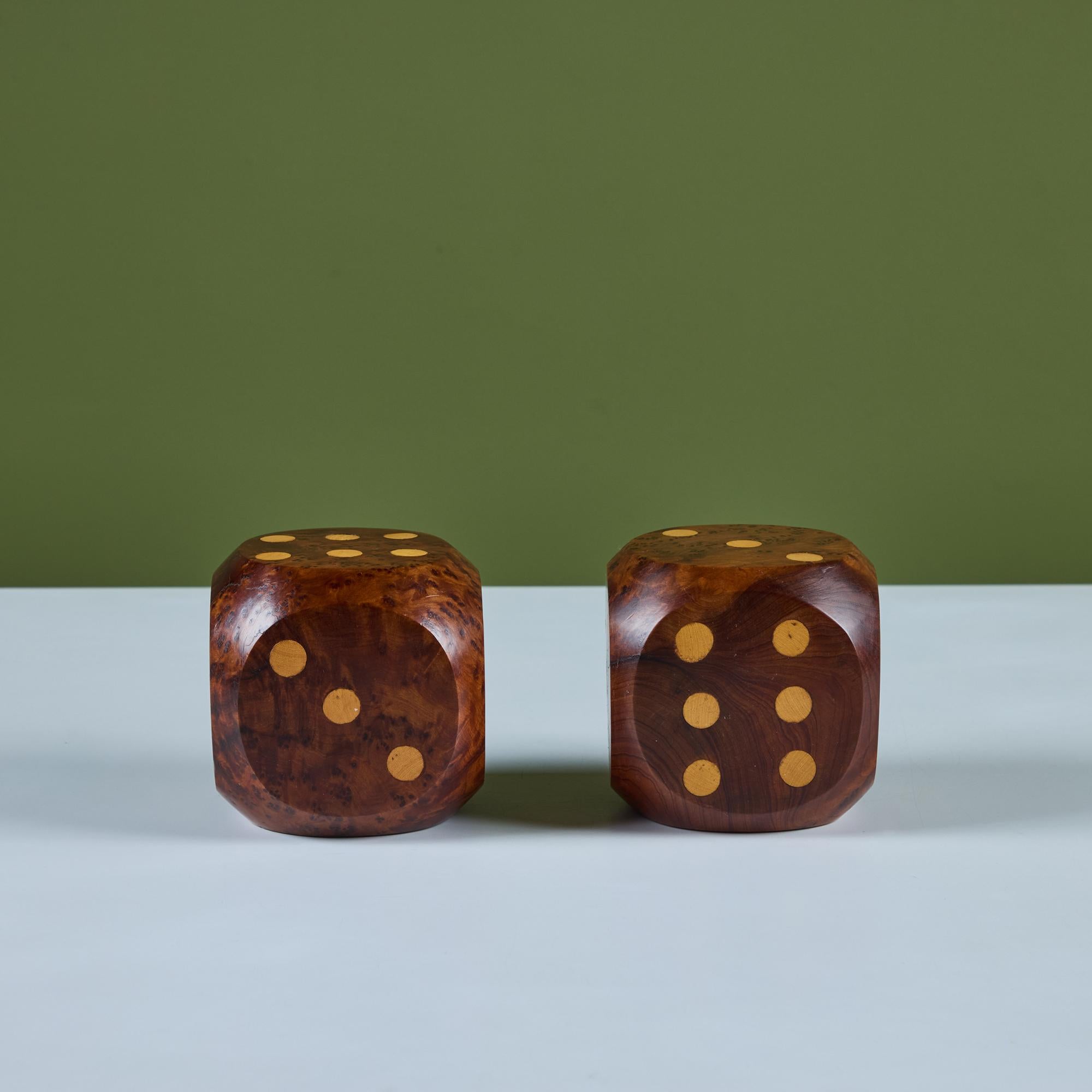 A pair of solid burl wood decorative dice with contrasting maple wood inlay showcasing the numerical numbers on each side of the die. These playful pieces would be great in a game room or library bookshelf as bookends. 



Dimensions
4