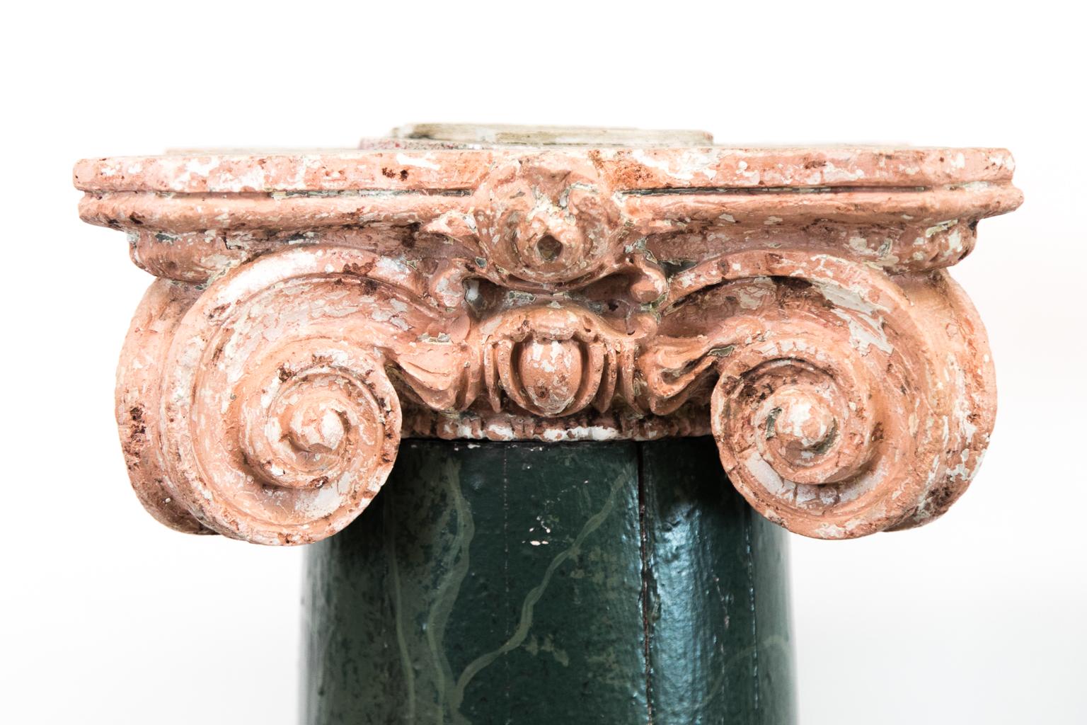 Pair of wooden faux painted marbleized pedestals have removable terracotta capitals.
 