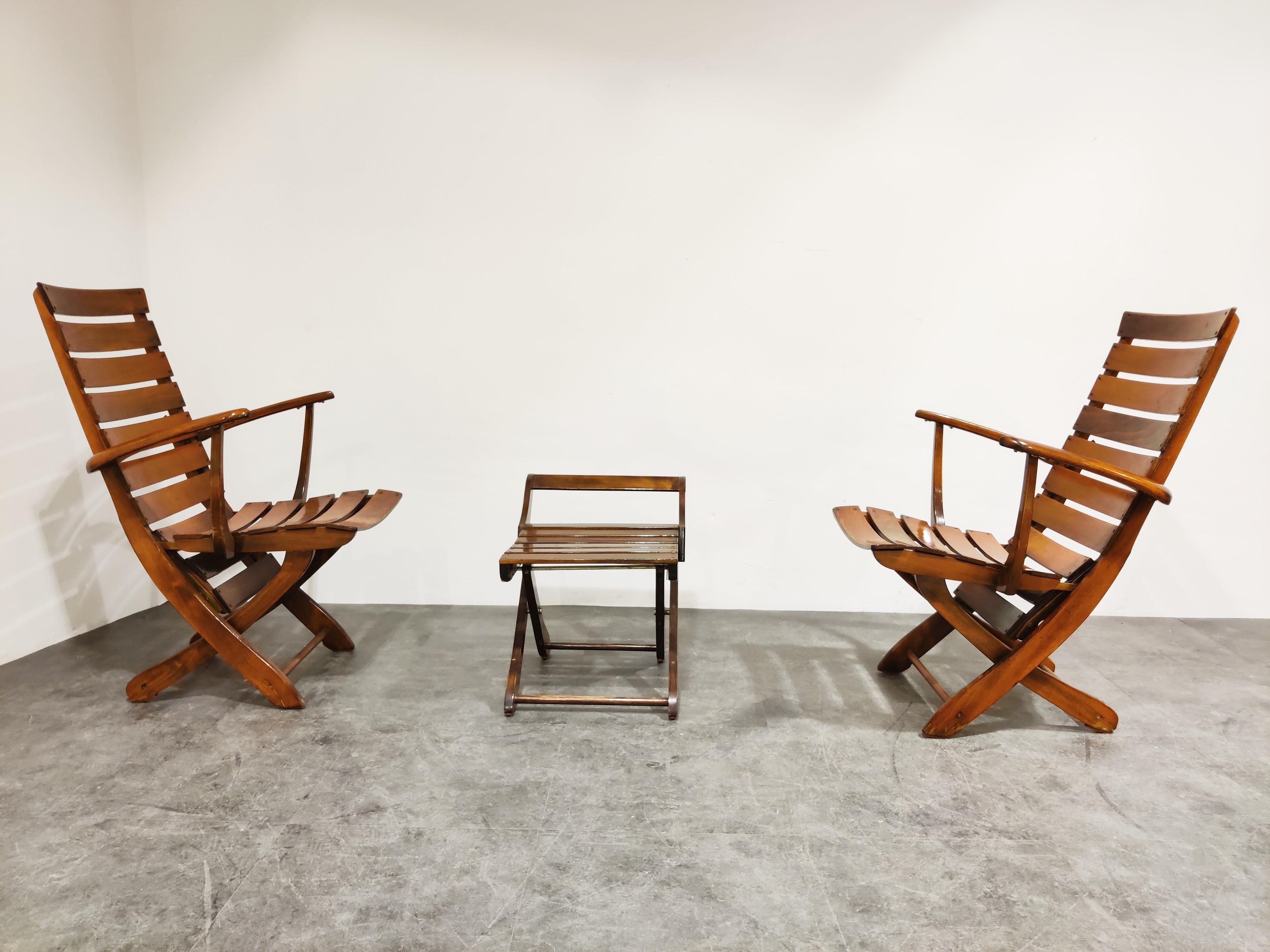 Midcentury folding armchairs or lounge chairs.

The chairs can be changed from normal garden chairs to some lovely lounge chairs. They come with the matching stool or side table.

Very high quality chairs with great organic design and a