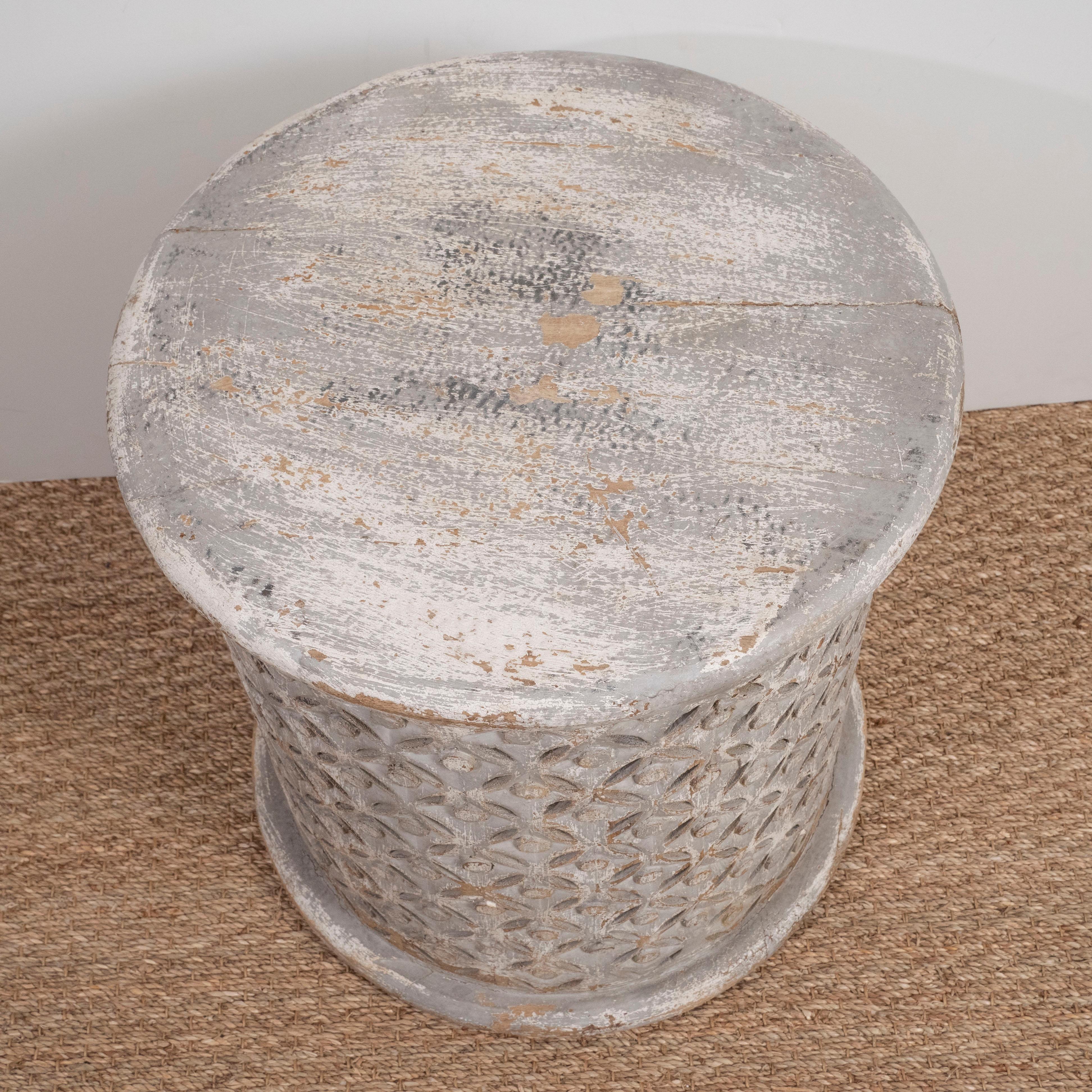 These round wooden garden stools are complete in a grey washed finish and patterned carving. Perfect for a casual room or beach house.