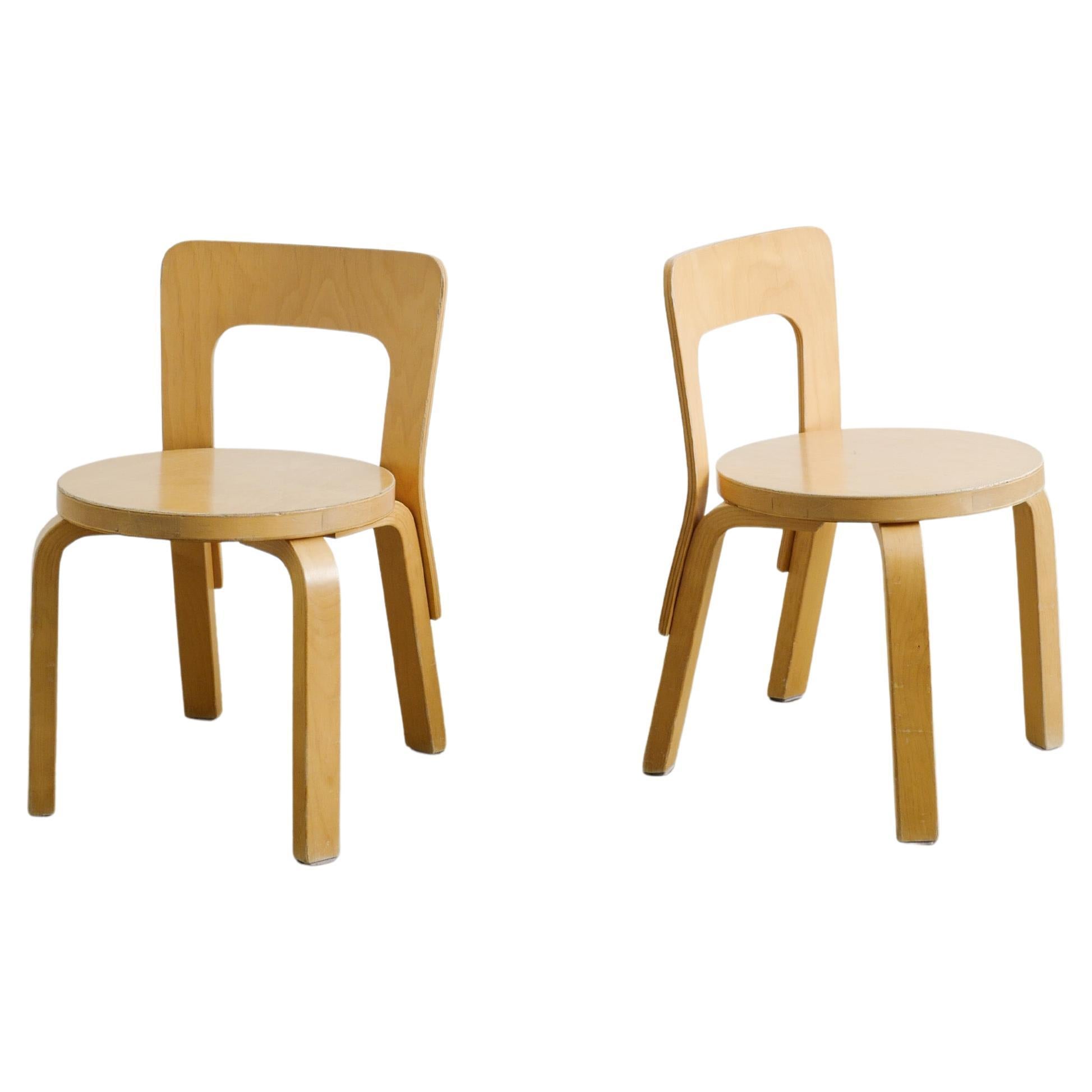 Pair of Wooden N65 Children Chairs by Alvar Aalto produced by Artek Finland 1990 For Sale