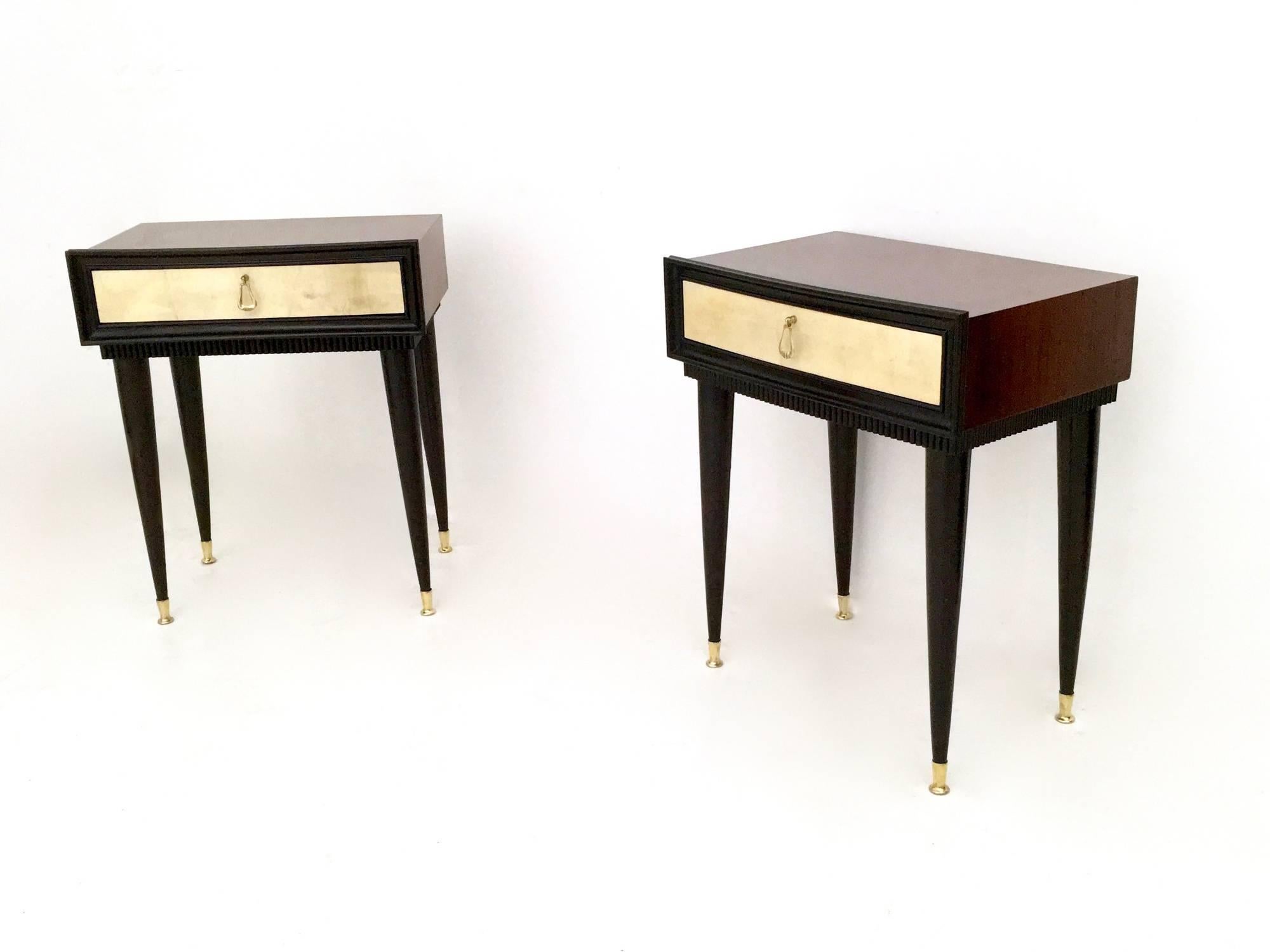 These nightstands are made in wood and ebonized wood. 
They feature parchment drawers and brass handles and feet caps. 
They may show slight traces of use, but they are in excellent original condition. 

Measures: Width 50.5 cm
Depth 33