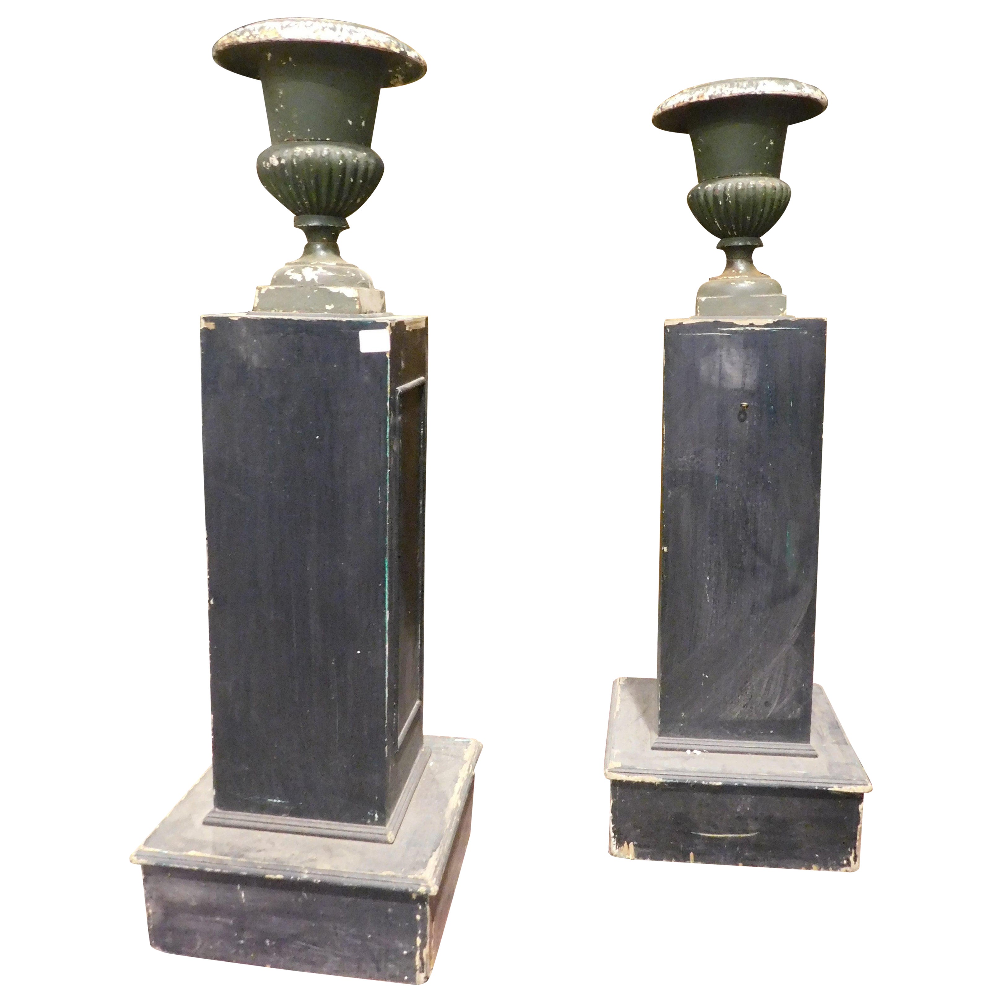 Pair of wooden pillars with attached cast iron vases, Italy For Sale