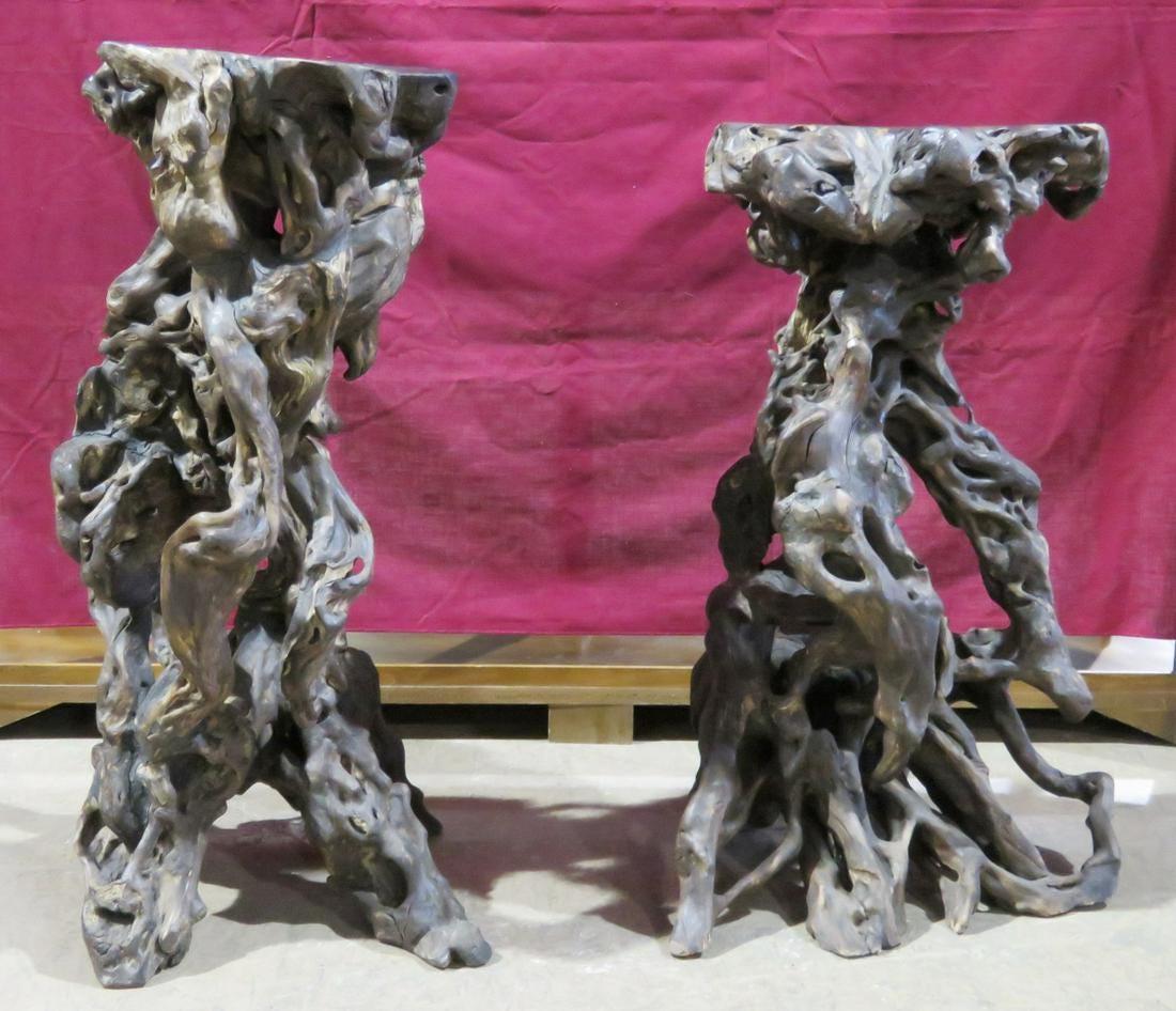Sculpted from naturally twisting tree roots, this unique pair of stools is perfect for seating or for use as decorative pedestals in a home or patio setting. Please confirm item location with seller (NY/NJ). 

Dimensions:

One measures 19.5 W x