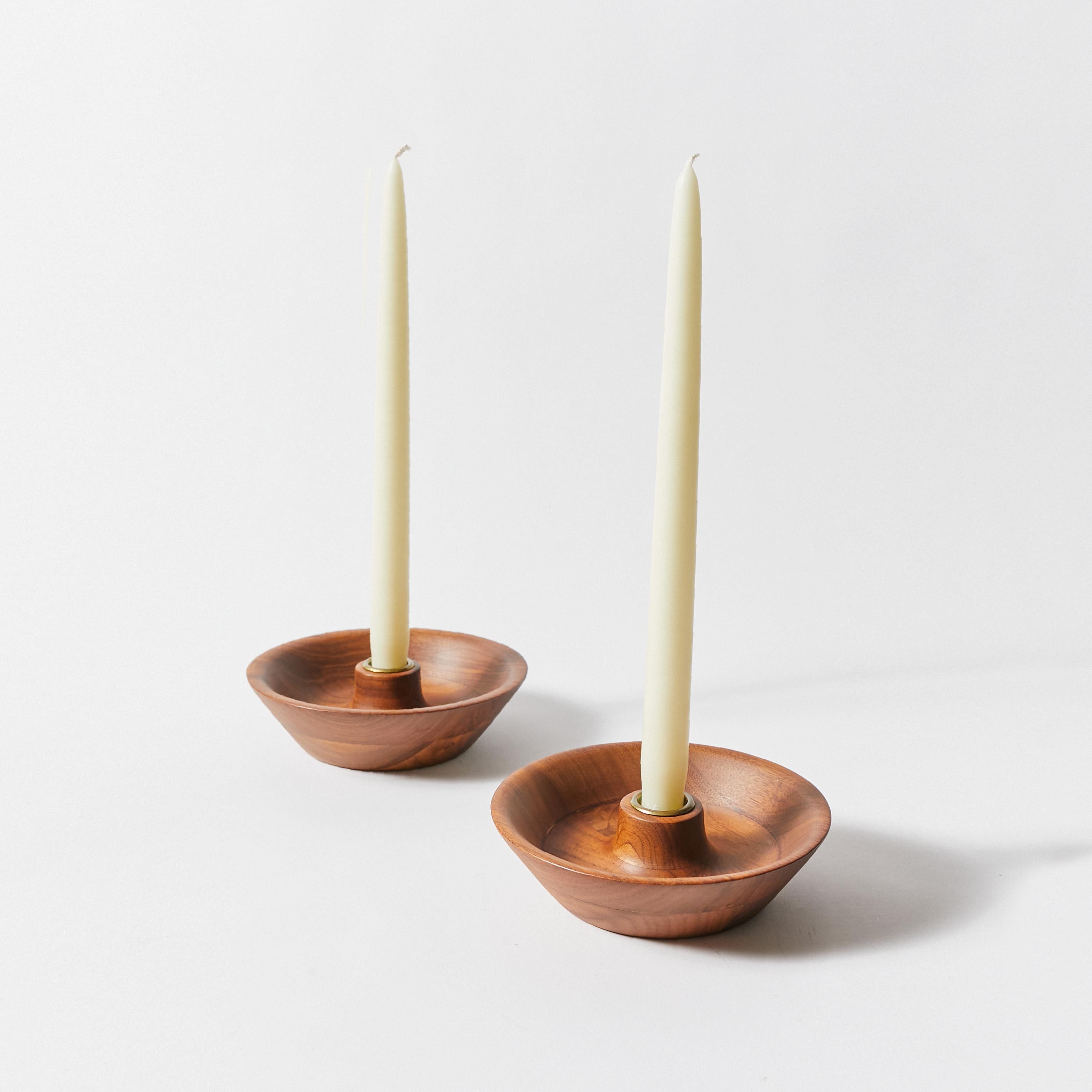 Set of two wooden candle holders by Dansk. Saucer tray in wood and candle cap in bronze. Not stamped.