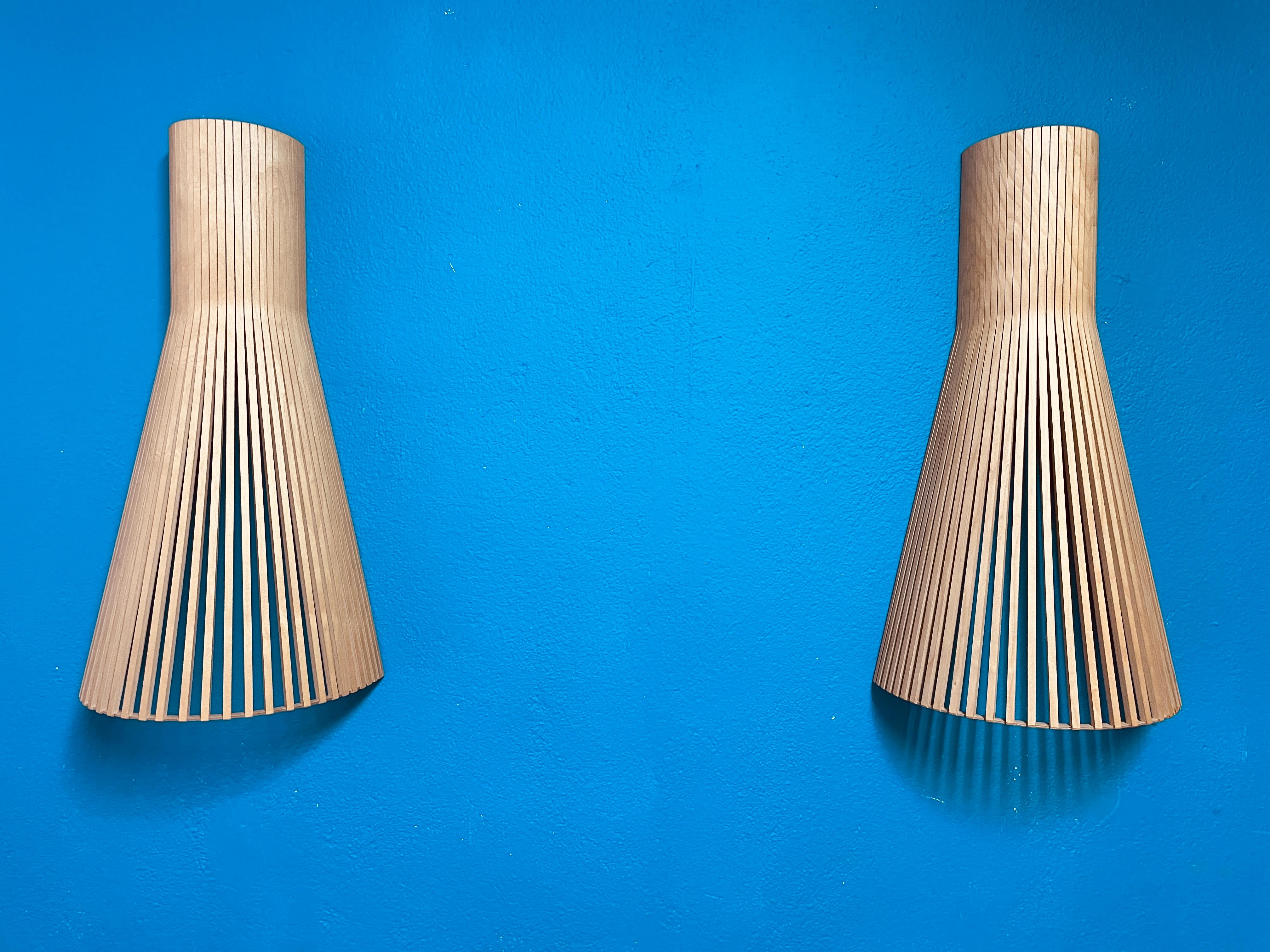 These natural birch colored wall lights can be placed facing either upwards or downwards. Enlivens plain hallways and creates an inspiring mood.

Handmade of PEFC-certified form pressed birch in Finland by highly skilled craftsmen. The wood