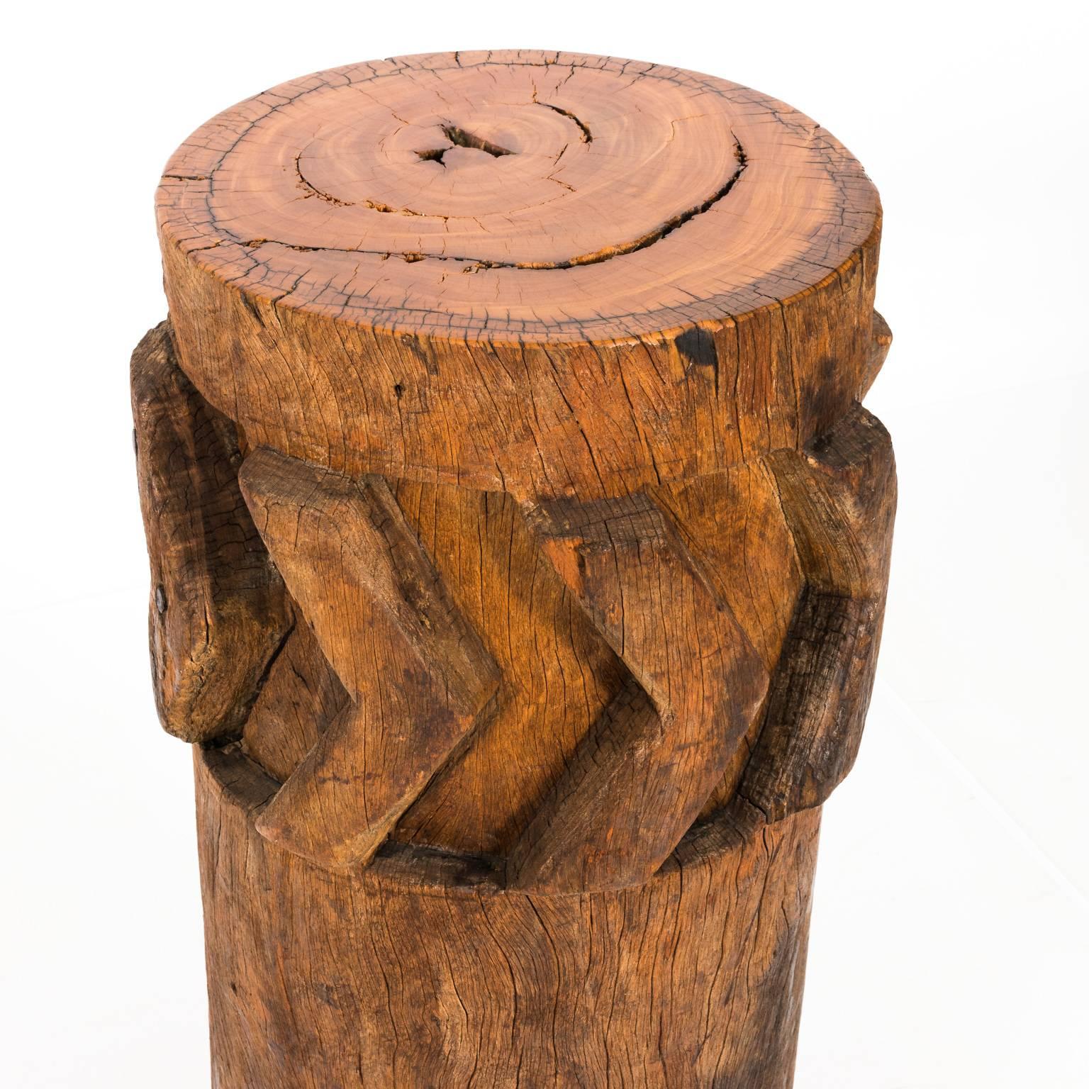 Early 20th century wooden African sugar grinders that can be utilized as a pedestal table in a rough-hewn finish.