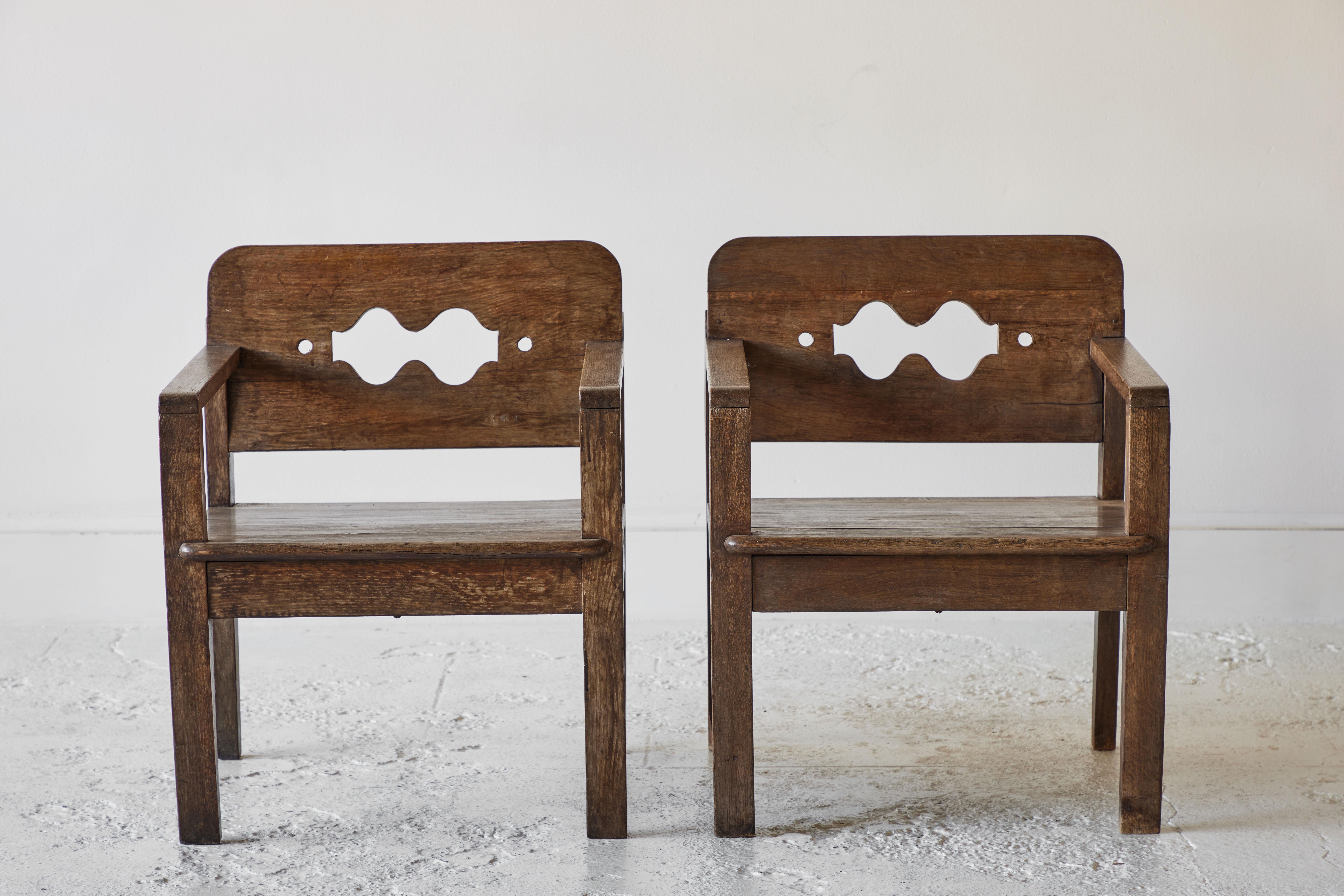Pair of wooden Swiss armchairs.