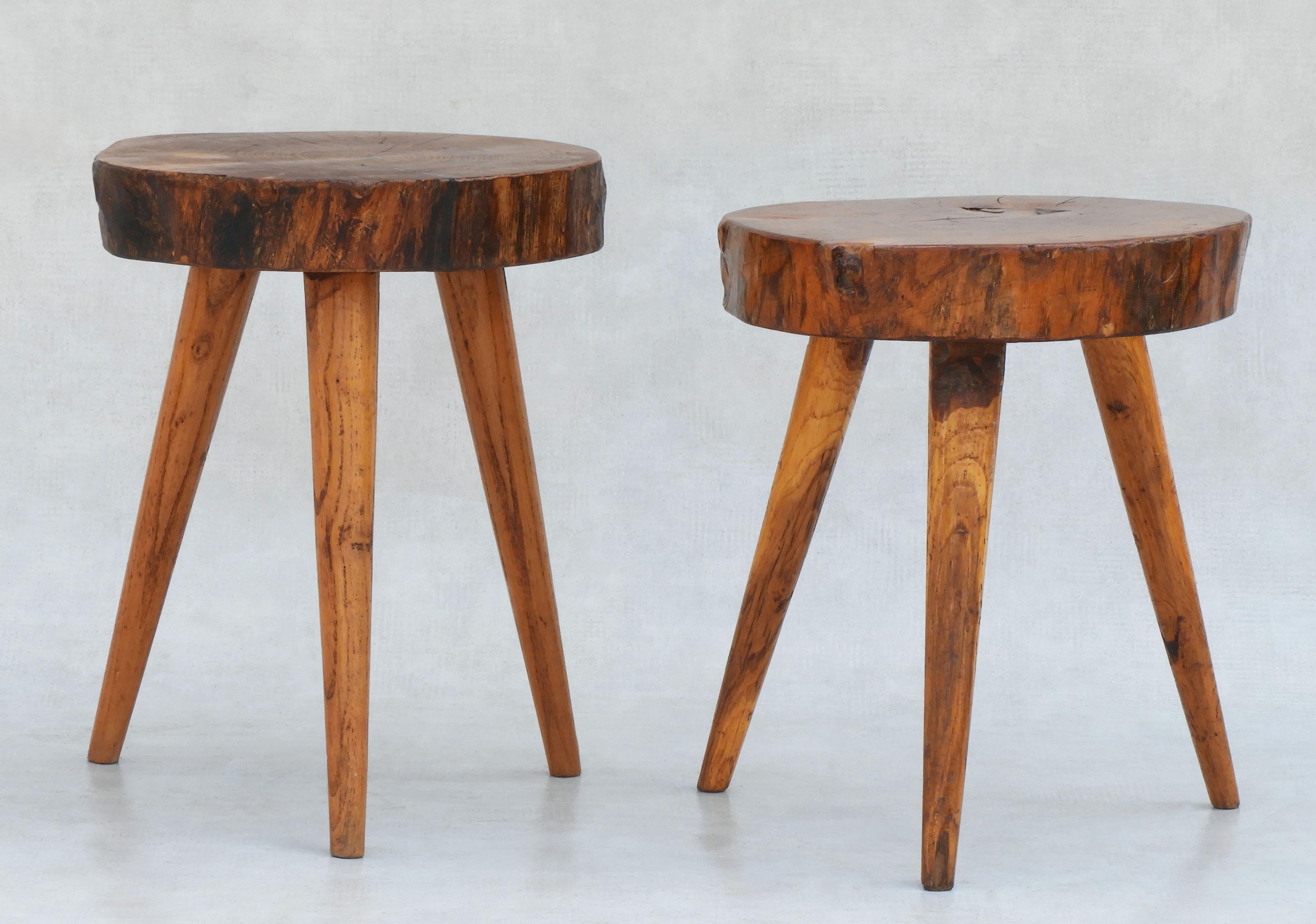 A fabulous pair of wooden three-legged tabouret stools handcrafted in France C1950. Well made, solid and sound with no hardware. Live edge, good grain, great patina. A really nice example of mid-century handmade French Arte Populaire in great