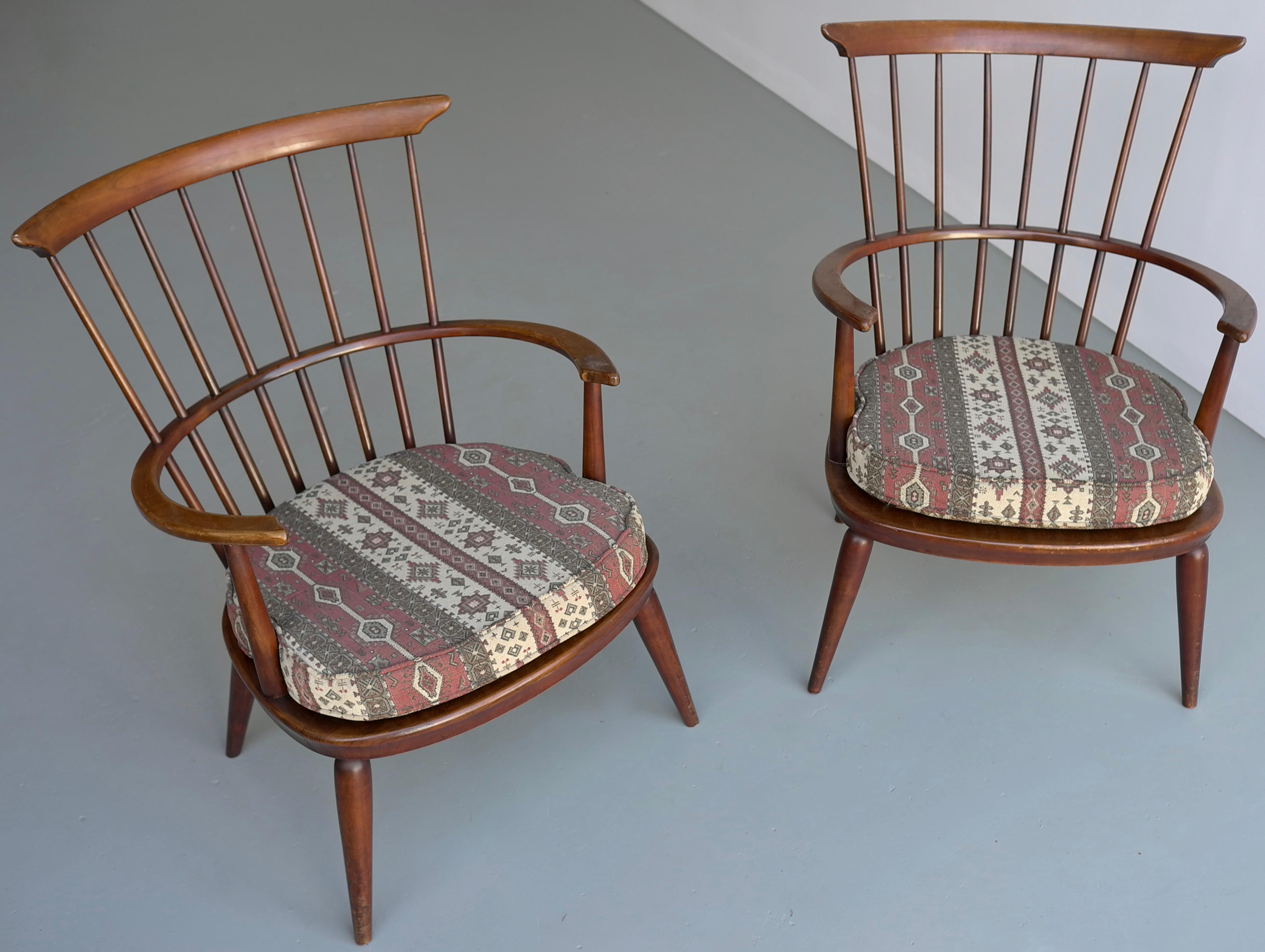 Pair of wooden Windsor armchairs by Luigi Ercolani.