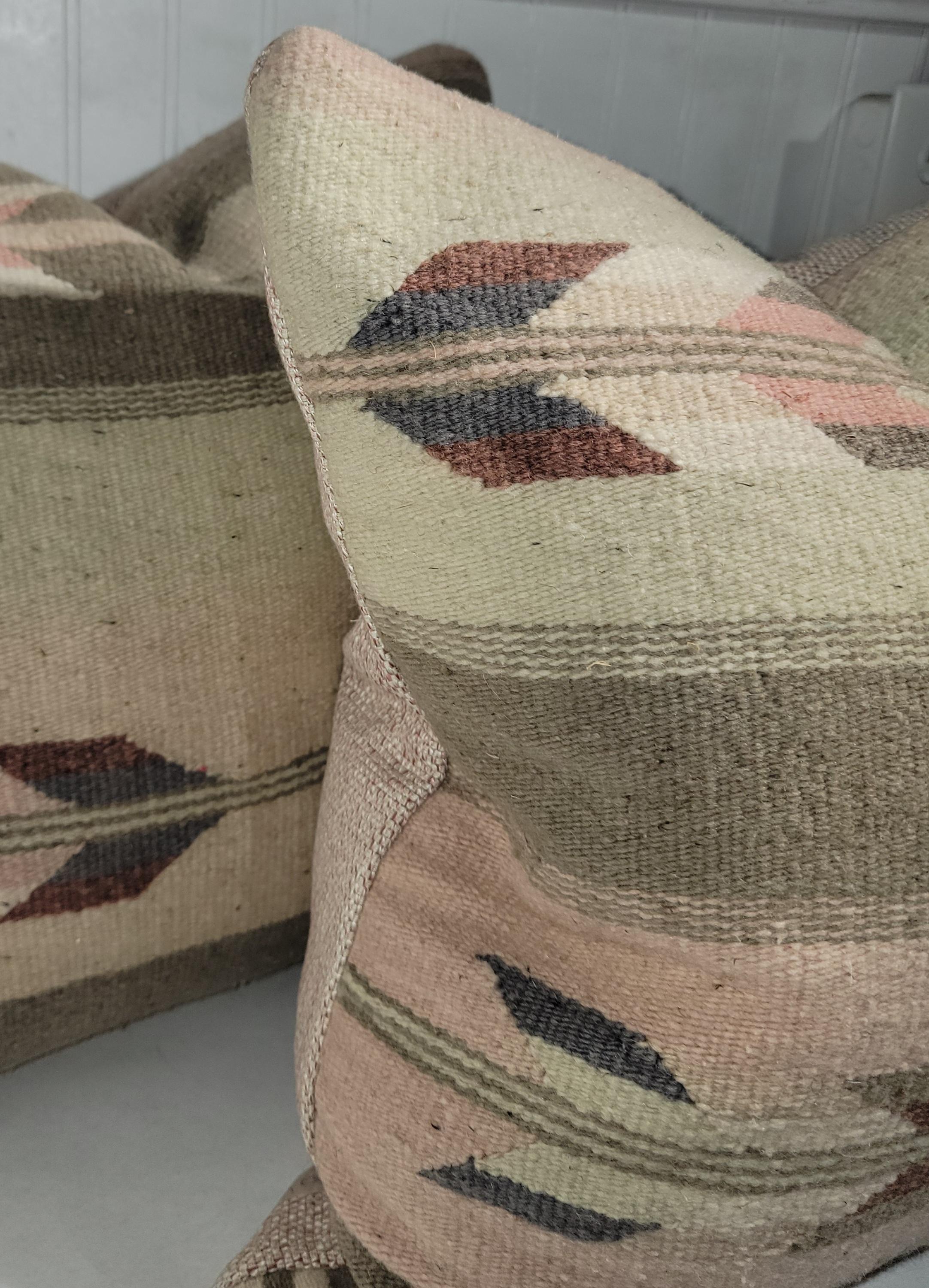 Pair of wool arrow pillows. 
This pair has beautiful earthy colors arrow pillows has a beautiful rich natural color pallet. These are great in a natural colored Adirondack room with a cabin like feel. Wonderful wool and linen make this pillow a