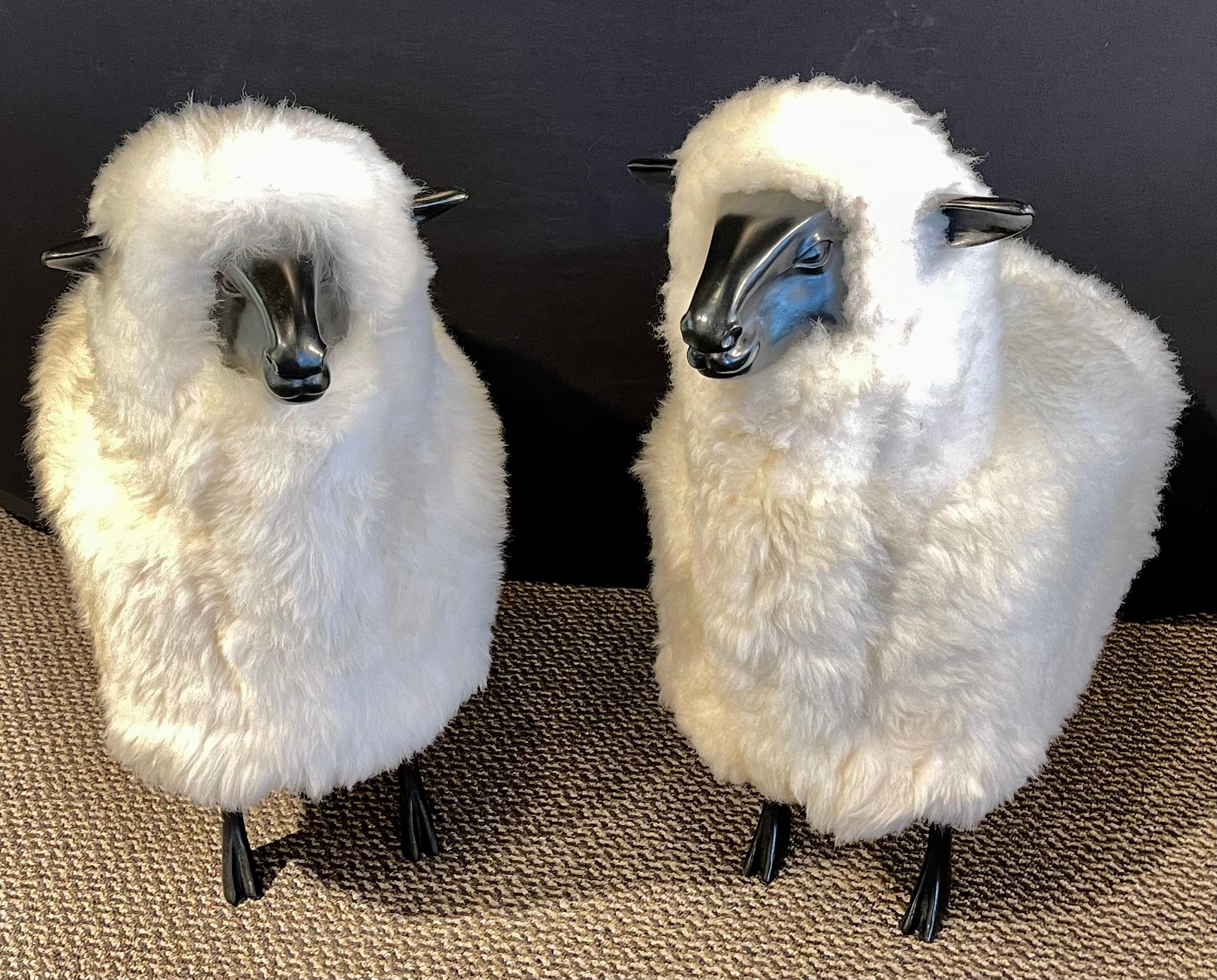 Pair of Mid-Century Modern Francois Lalanne Style Sheep Sculpture, Wool / Resin
 
Pair of decorative wool / resin sheep. Each finely detailed in real shearling. The pair in fine condition. There is a large sheep sold separately.
 
This is part of