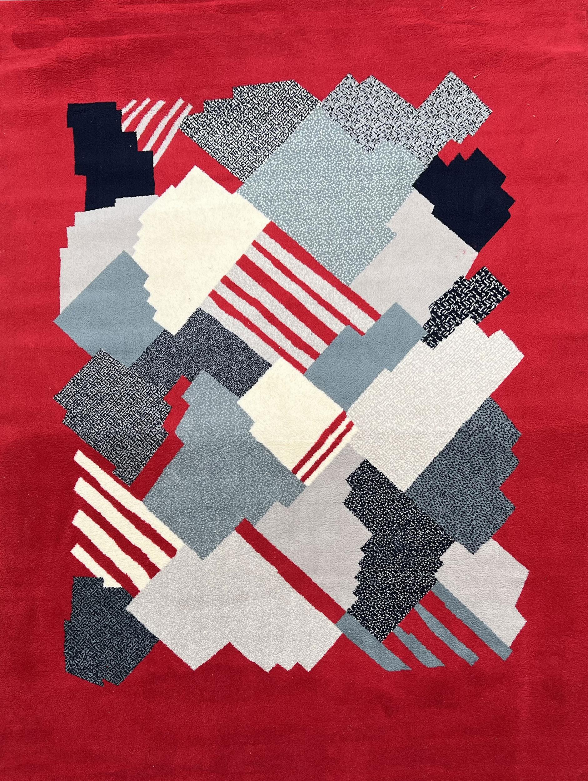 Pair of wool mechanical rugs with geometric decoration in shades of red, grey and white. France circa 1970.

In very good condition.

Length: 225 cm (88.6 inches - 7.4 feet)
Width: 170 cm (67 inches - 5.6 feet)
