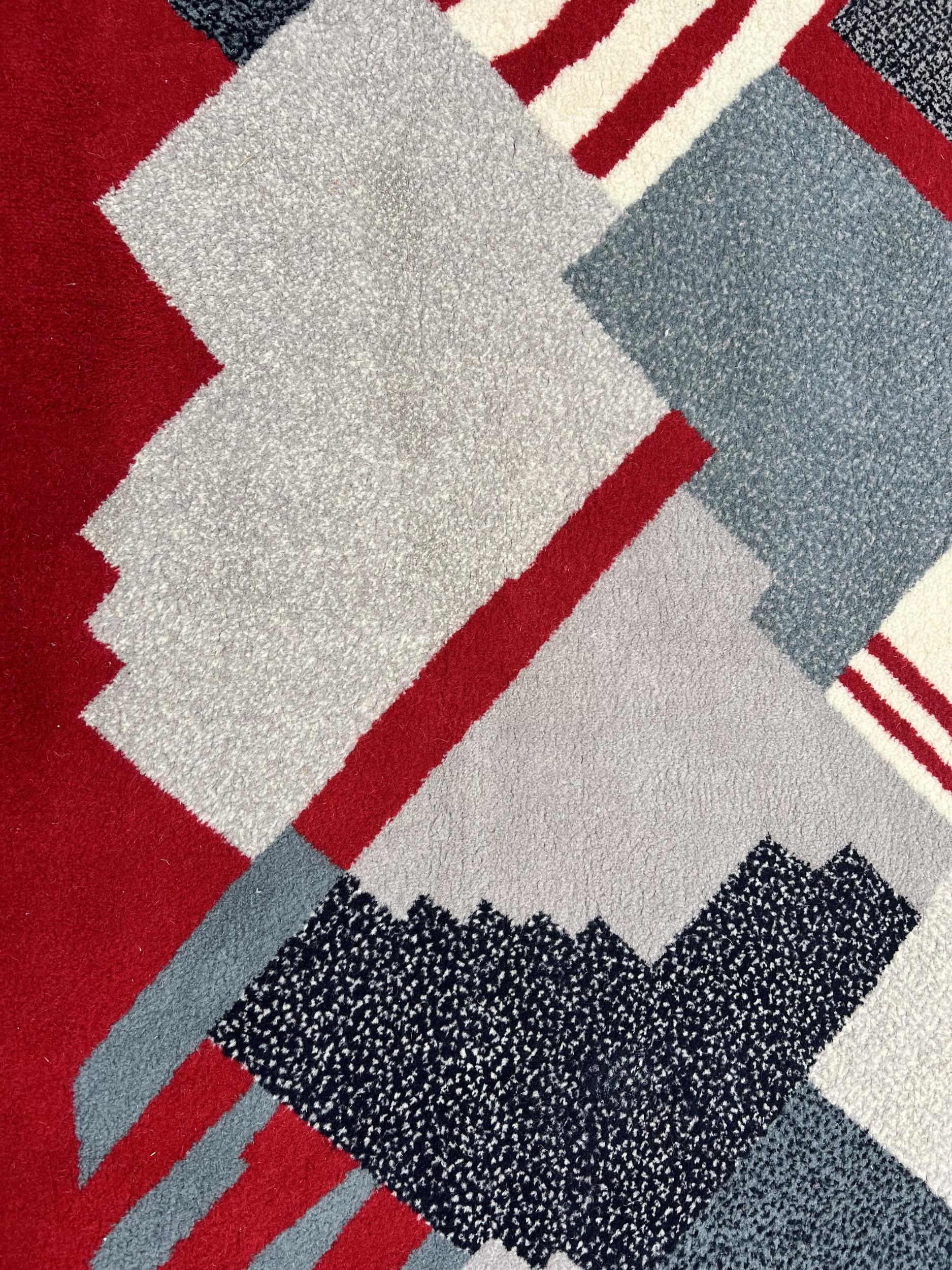 French Pair of wool rugs with geometric decoration, France, circa 1970 For Sale