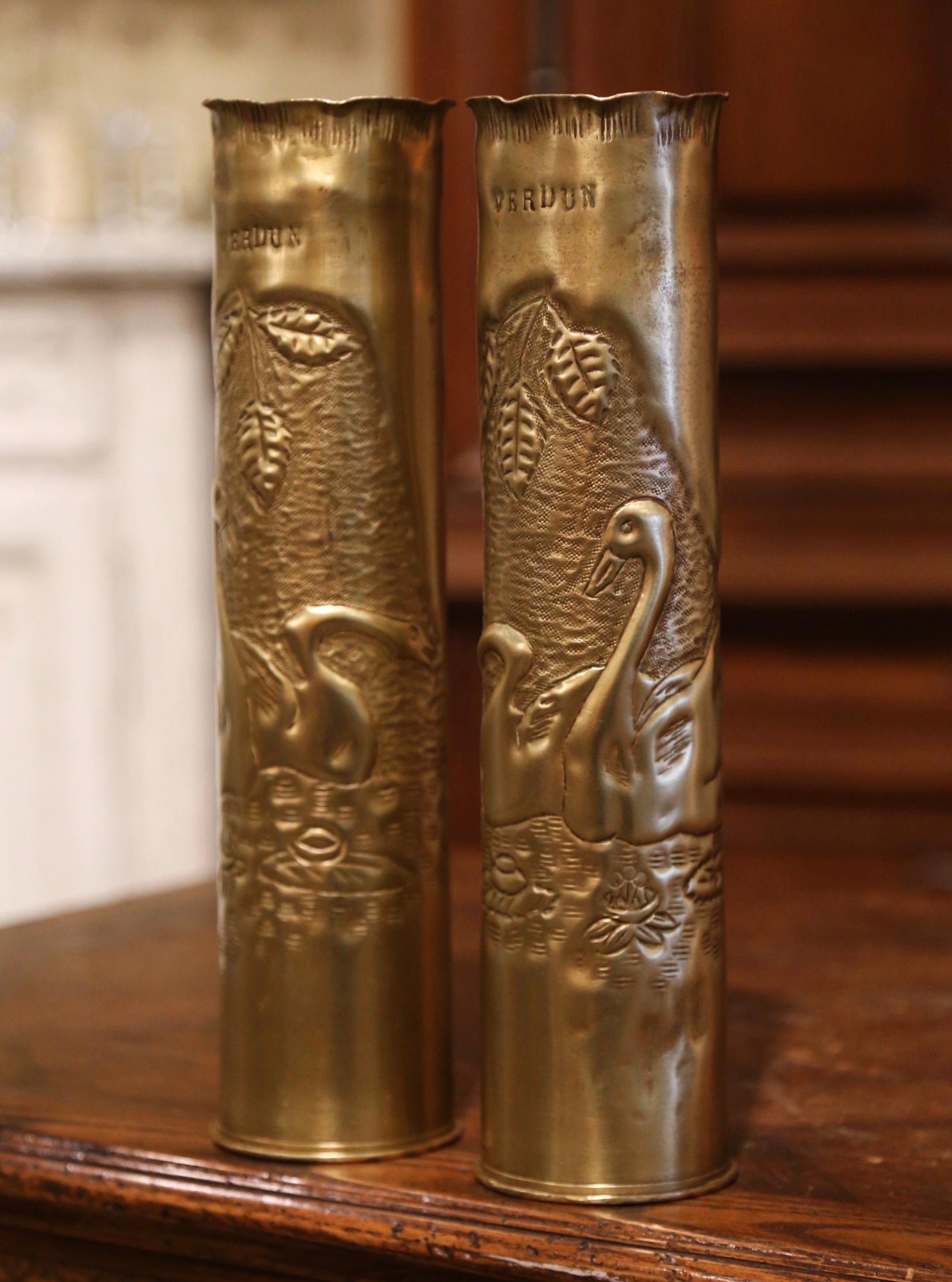 Decorate a man's office or a study display shelf with this pair of antique trench art shell vases from 