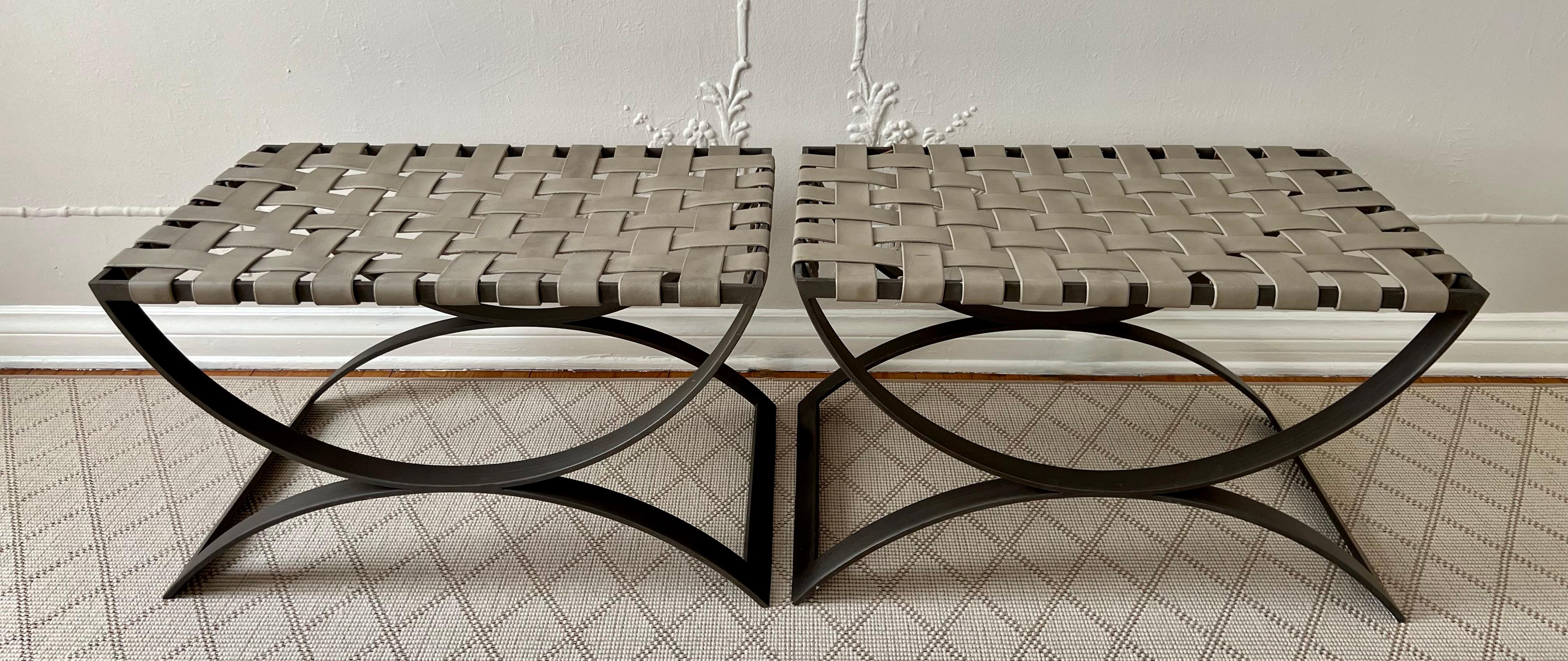 A very nice pair of modern Wrought Iron Frame benches with taupe leather woven seats. The pair are very handsome and sturdy. 

A compliment to many rooms - could be slid under a console table and pulled out for extra guests, used as ottomans,