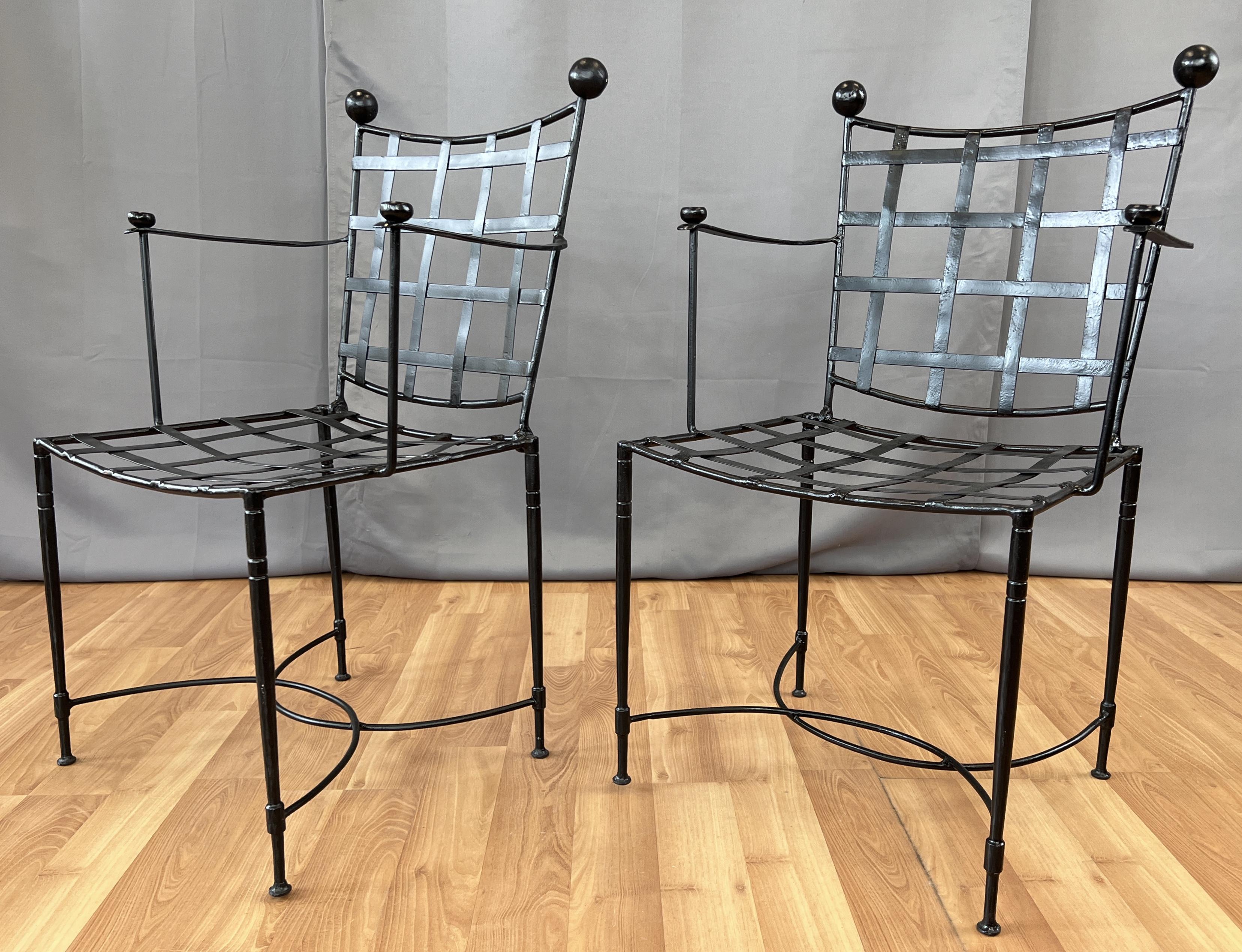A classic pair of woven seat and back rest patio chairs that were designed by Mario Papperzini for John Salterini.
Four slender legs connected to each other with two U shape braces, which those in turn hold the woven seats and backs.
At the ends of