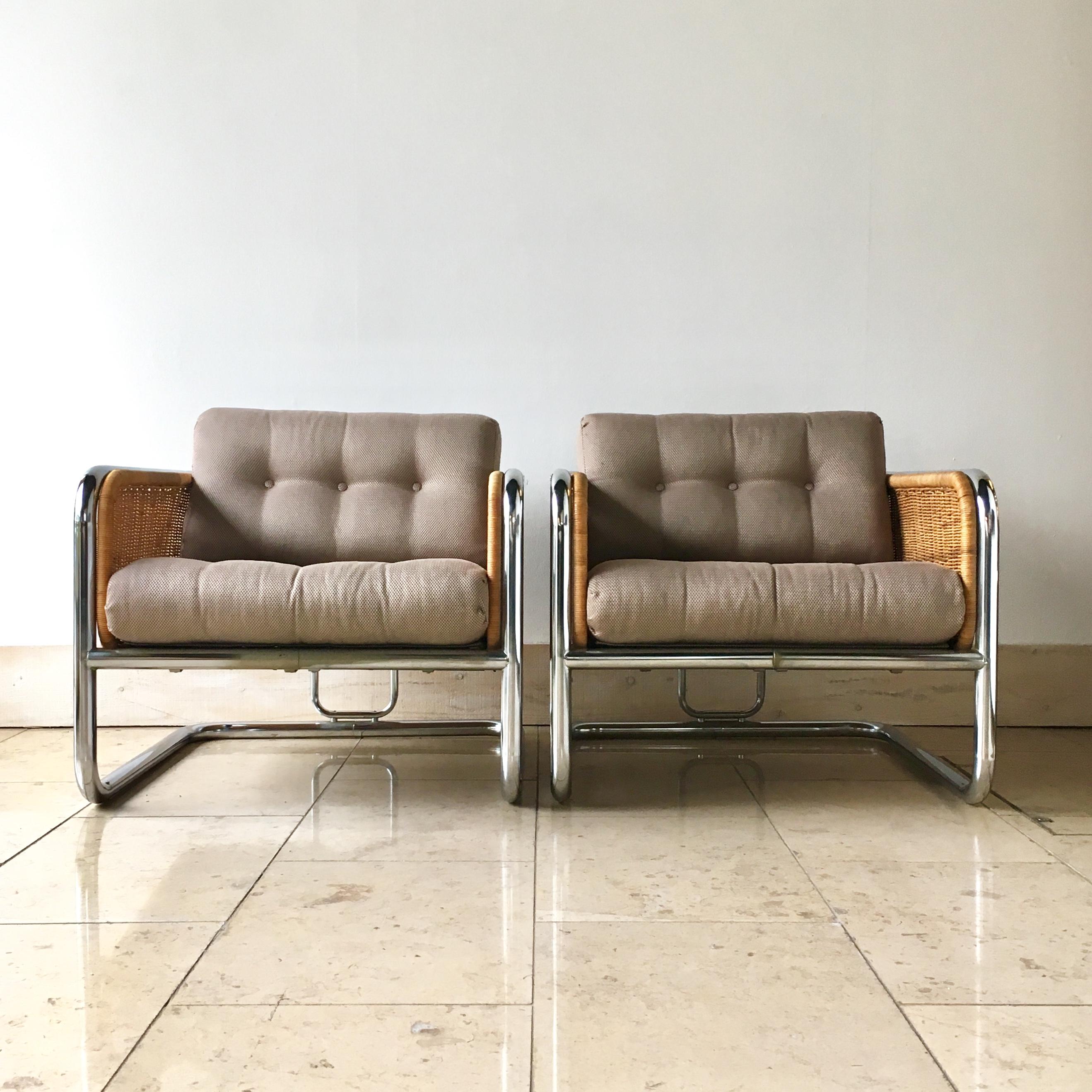 Pair of woven rattan and chrome framed chairs with seat two buttoned seat pads attributed to Martin Visser 1960s. 
Reupholstered by Talisman in a tightly woven graphic fabric with luminous sheen by Lelievre.