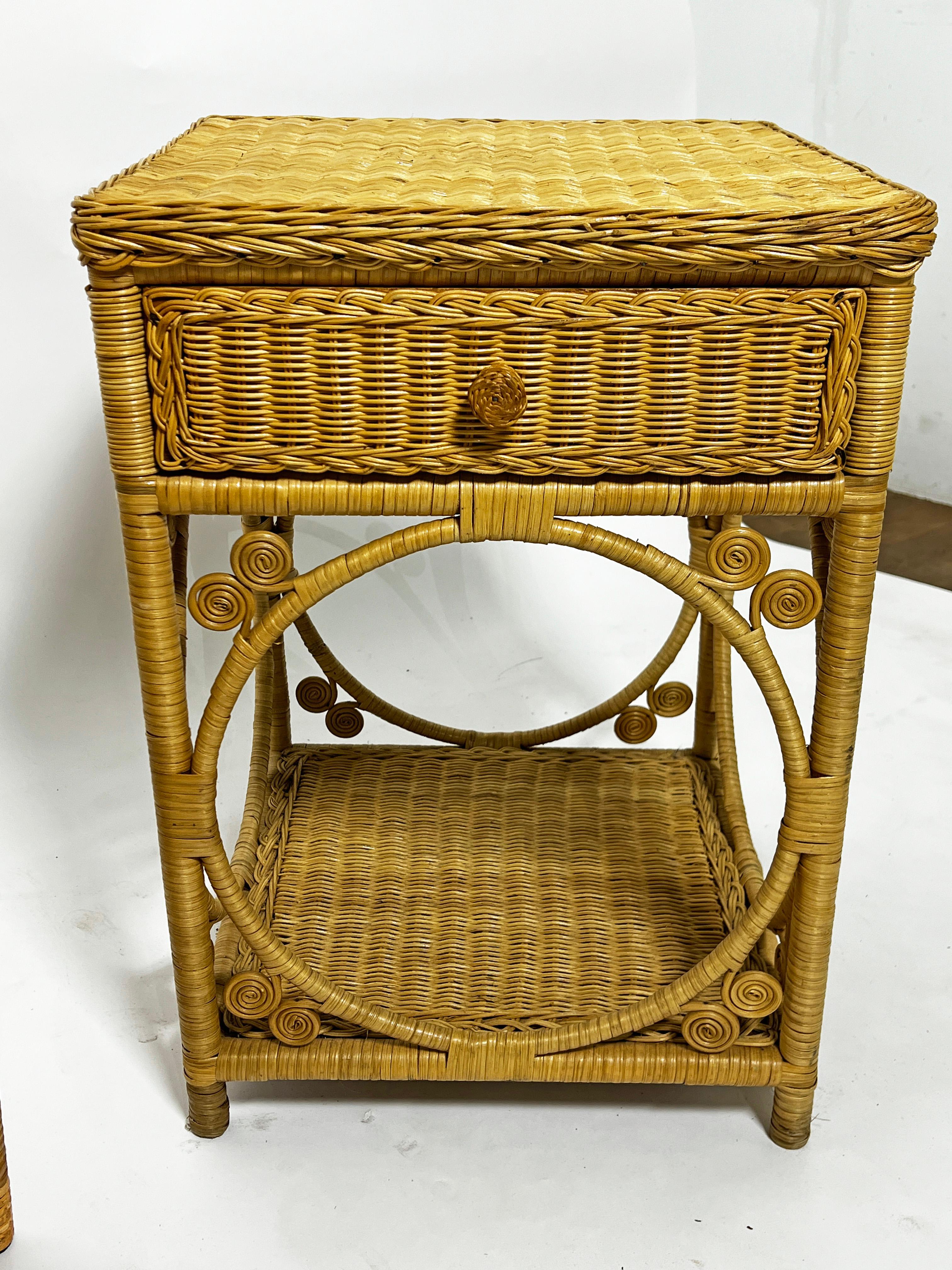 Pair of woven wicker nightstands with single drawers and cane wrapped accents, circa 1970s. These have finished backs, so could also be used as end tables.